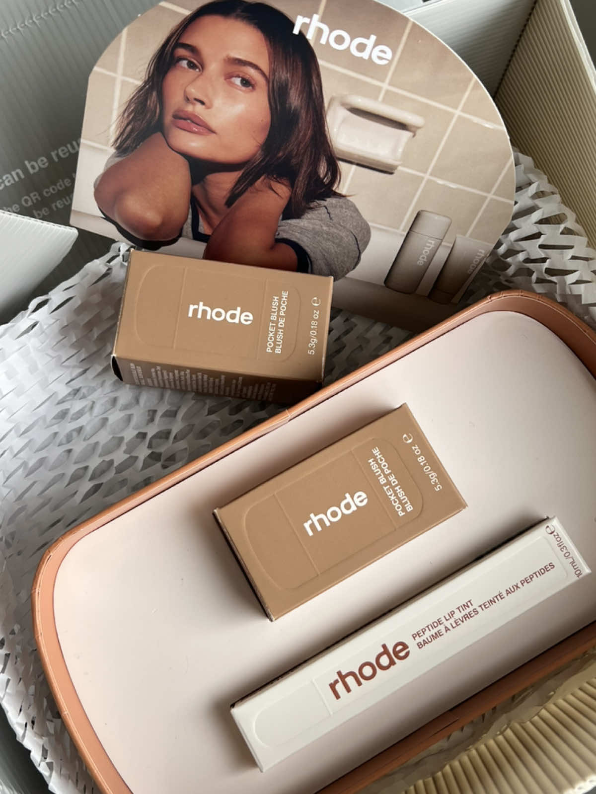 should i do a try on ? @rhode skin #rhodeskin #makeuo #pocketblush #liptint #haileybieber #blush #lipgloss #liptreatment 