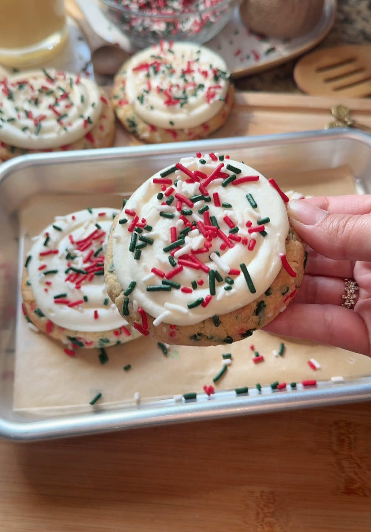 Christmas sugar cookies🎄☃️✨                                                   Recipe:                                                                 Ingredients  Cookies -2 cups + 2 Tbsp all-purpose flour (255g) -1/4 tsp baking powder  -1/2 tsp baking soda -1/4 tsp salt -10 Tbsp unsalted butter, softened (141g) -1/2 cup granulated sugar (100g) -1/3 cup light brown sugar, packed (71g) -1 egg, room temperature  -1 1/2 tsp vanilla  -3/4 cup sprinkles (120g) (plus more for topping) Cream cheese frosting -6oz cream cheese, softened (170g) -5 Tbsp unsalted butter, softened (70g) -1 tsp vanilla -Pinch of salt -2 cups powdered sugar (227g) Instructions For the cookies:  1. Preheat oven to 350°F. 2. In a medium bowl whisk together flour, baking powder, baking soda, and salt. Set aside. 3. In a large bowl beat the butter, granulated sugar, and brown sugar until light and fluffy. 4. Add the egg and vanilla. Mix until combined. 5. Slowly mix in the dry ingredients until just combined. 6. Fold in the sprinkles. 7. Scoop the dough using a 3 tablespoon cookie scooper and place on a lined baking sheet. Press down on each cookie dough to flatten them out a bit. Bake for about 9-11 minutes. Let the cookies cool before frosting.  For the cream cheese frosting: 1. In a bowl beat the cream cheese, butter, vanilla, and salt until smooth and combined. 2. Add the powdered sugar and mix until combined. 3. Add the frosting to a piping bag and pipe a swirl on the cookies. Add some more sprinkles on top. #christmas #sprinkles #sugarcookies #baking #Recipe #bakingtiktok #recipeideas #christmasbaking #christmastiktok #bakingvideo #dessert #foryou #bakingtherapy #baketok #fyp 