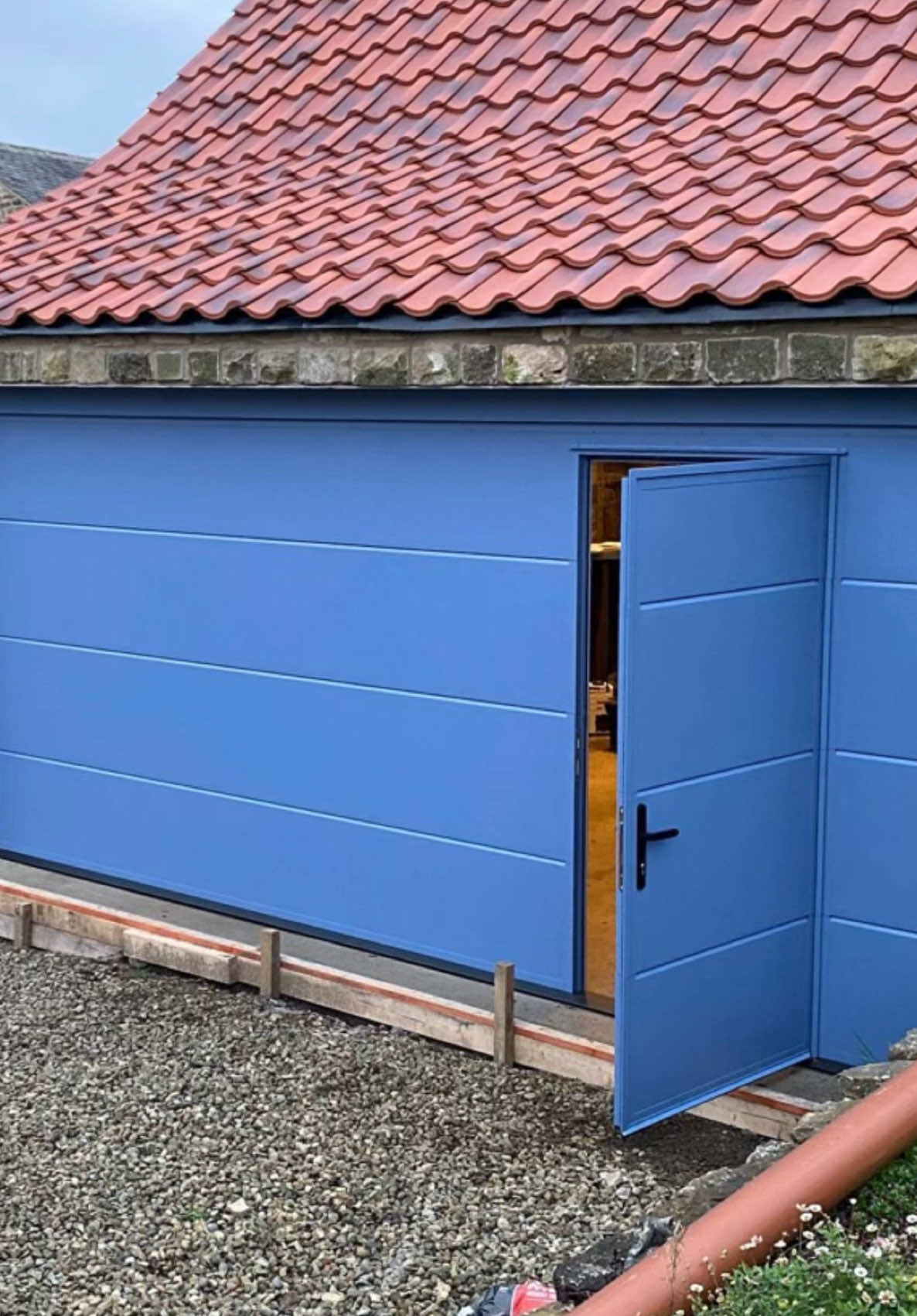 A stunning Ryterna pigeon blue sectional garage door with a convenient wicket door installed in North Yorkshire 😍 #fyp #construction #newgaragedoor #garagedoors #yorkshirehomes #garagegoals #yorkshire 