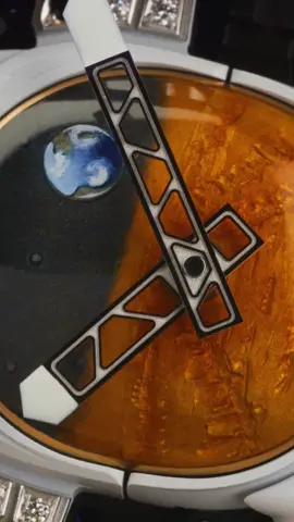 Mars has always been an inspiring subject for Pharrell—beautiful and poetic, related to time and space, and an all-new concept for a singular watch. He envisioned the RM 52-05 as an homage to this extraordinary planet, brought to life in collaboration with an engraver, an enameller, and a painter. Released in 2019, this scene worthy of a science-fiction movie unfolds within a tourbillon calibre constructed from titanium and blue aventurine glass. Pharrell’s vision is uniquely expressed in the titanium visor of the astronaut’s helmet, where a glowing Earth as seen from Mars, setting amongst a sea of golden stars. As a true lover of sapphire, Pharrell hoped to admire the calibre through sapphire walls, a wish fulfilled by the brand, which replaced the brown cermet case with an entirely sapphire structure. This innovation offers a view akin to peering at Mars through the porthole of an extraordinary timepiece spaceship.