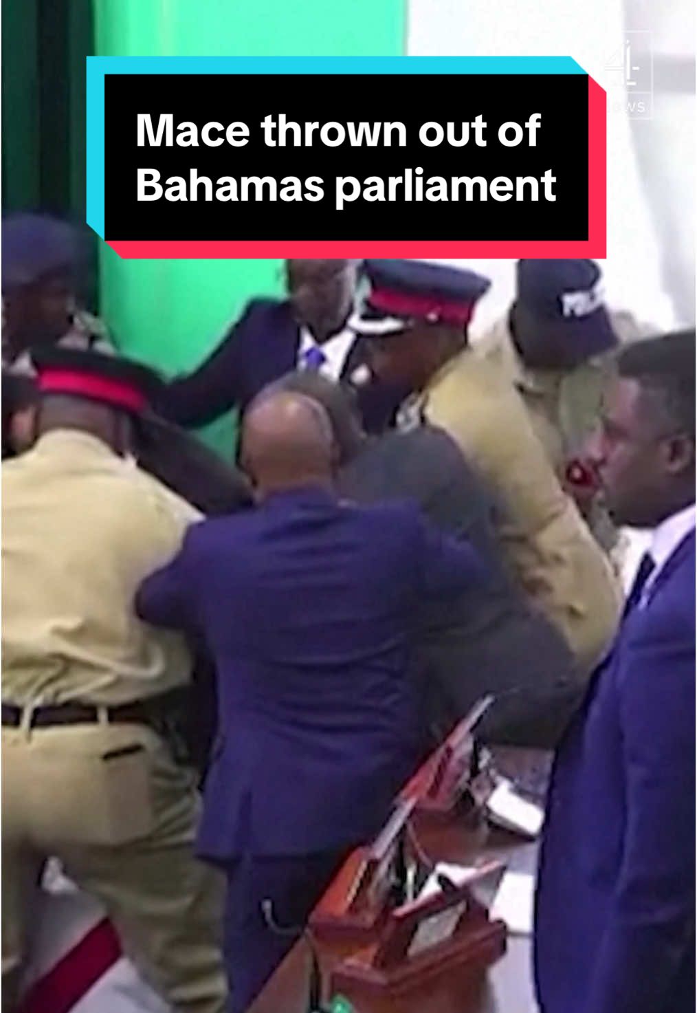 This is the moment a ceremonial mace is thrown out of the window in Bahamas parliament. The session became heated when the Speaker refused to allow the opposition to address allegations related to a US indictment accusing federal police of drug trafficking. #Bahamas #CeremonialMace #Parliament #Channel4News