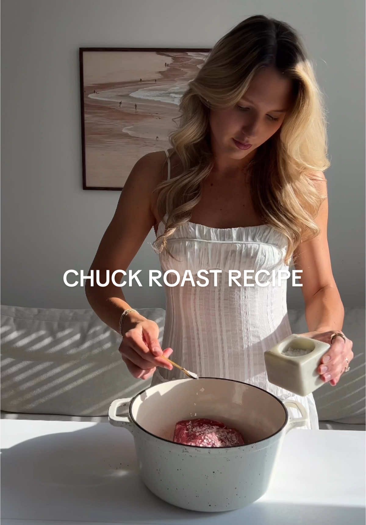 Viral Chuck Roast is my new found love for a cozy meal 🥩✨ You have to try this simple method to making the best chuck roast that is robust with flavor while having the perfect balance of tenderness and crisp!  CHUCK TOAST RECIPE Chuck roast  Salt flakes Freshly cracked pepper Instructions:  Add your chuck roast into a dutch oven or covered baking dish. Season both sides generously with salt and pepper.  Bake an hour per pound at 325F with the lid on. (I baked for 3 hours since mine was 3lb).  Remove from the oven and increase the temperature to 425F. While the oven is heating, shred your roast using two forks. If it doesn’t fall apart when shredding, bake for an extra 20 minutes or so (it should be simple to shred).  Place back in the oven without the lid and bake for 20-25 minutes!  Found this amazing recipe from @olivia.adriance !!!  Enjoy with my delicious sliced garlic potatoes and fancy brussel sprouts (recipes coming tomorrow)✨🍽️  Comment if you are trying this out and save for your next cozy dinner🤍  Wearing @peppermayo 🤍👗 #chuckroast #viralrecipe #healthyrecipes #dinnerrecipes #chuckroastrecipe #simplerecipe 