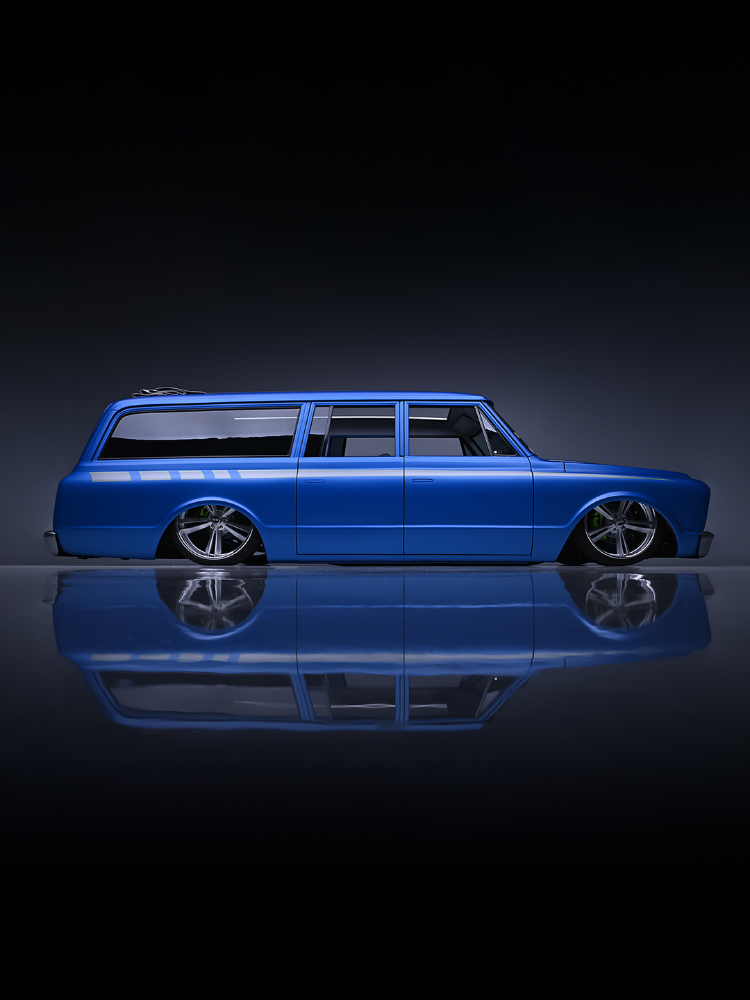 Big, bold and built to impress! This #custom 1969 @chevrolet #Suburban is powered by a 525hp #LS3 hooked to a 6-speed manual and rides on air suspension. Wrapped in Matte Blue with gray and green accents, it has a custom interior with  a massive sliding ragtop. See it cross the block with No Reserve, Jan. 18-26 at WestWorld during the 2025 #Scottsdale Auction.