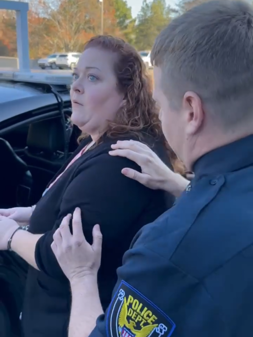 Larry sees his wife Bethany in the back of the car! 