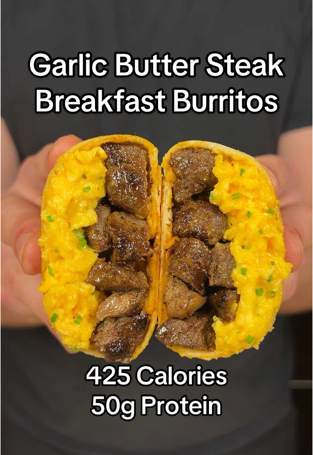 Garlic Butter Steak Breakfast Burritos  (Makes 10 Burritos)  If you like this recipe, make sure to check out my digital cookbook that has 100+ delicious recipes like this one! Link in my bio!  Macros Per Burrito:  - 425 Calories  - 50g Protein - 25g Carbs  - 17g Fat  Ingredients:  - 40oz Lean Steak (Top Round or Skirt) (1135g)  - 3 Tbsps Garlic Salt (30g)  - 2 Tbsps Black Pepper (15g)  - 3 Tbsps Light Butter (45g)  - 3 Tbsps Minced Garlic (35g)  - 20 Eggs (~1200g)  - 1 Cup Cottage Cheese (0% Fat) (225g)  - 1.5 Cups Fat Free Cheddar Cheese (168g) - Fresh Chives (20g)  - 10 Tbsps Hot Sauce (150g)  - 10 Low Calorie Tortillas  Additional Notes: To reheat the burritos, wrap the frozen burritos in a wet paper towel and microwave for 5-6 minutes. You can also toast it in a pan afterwards for a crispy exterior #highprotein #mealprep #protein 