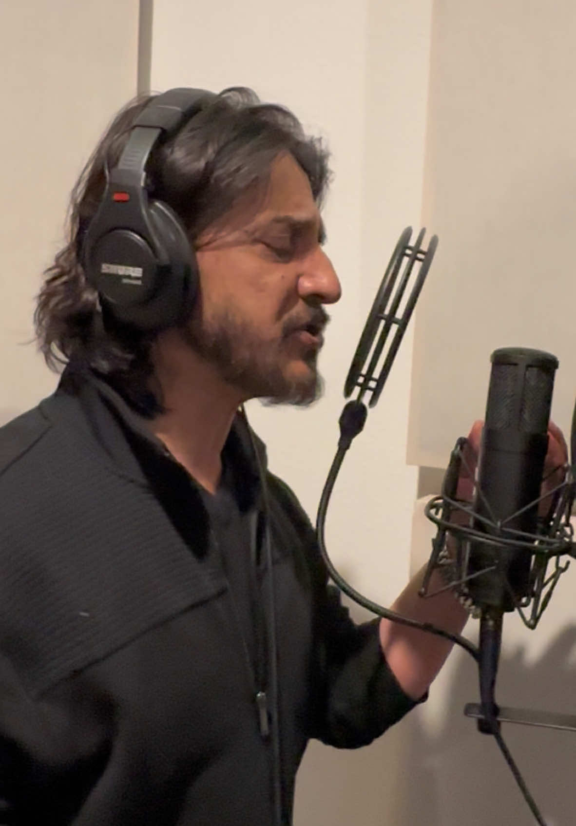 A short clip of Sharafat Parwani recording vocals for the song 