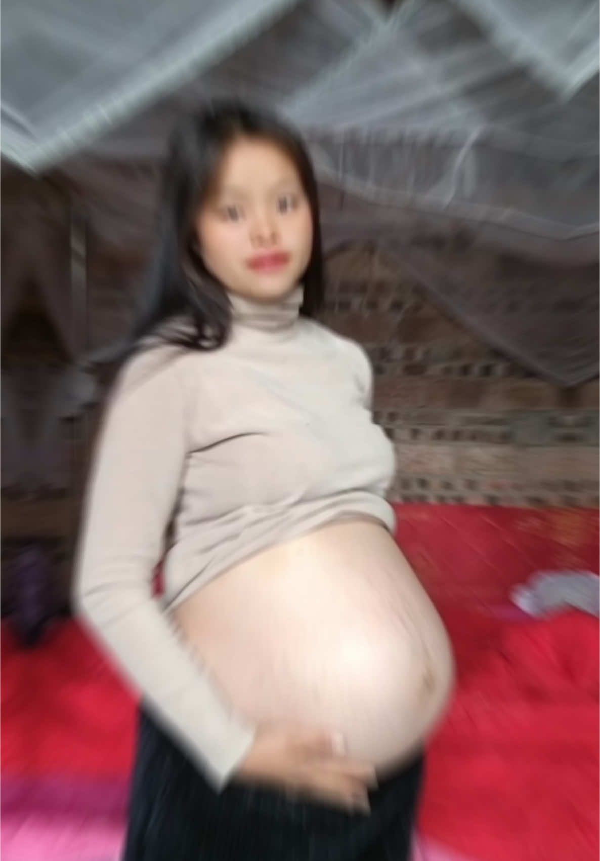 Young mom shows big pregnant tummy #bigbelly #pregnancy #hugebelly #asian 