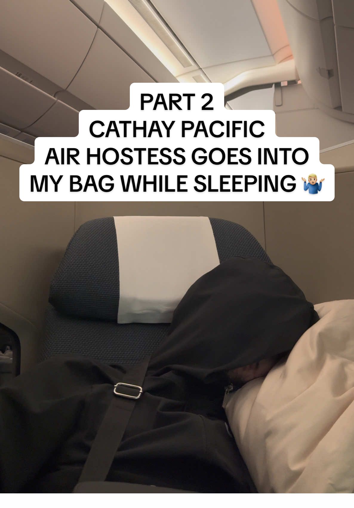 Replying to @allcruising 🍍🍍🍍  @Cathay Pacific ✈️ PART 2 So… This is the video 🤷🏼‍♂️ Watch carefully in the bottom left. Regardless of what he took out, is this aloud to happen to a passenger ? #cathaypacificairways #robbed #airline #whatareyourthoughts #fyp 