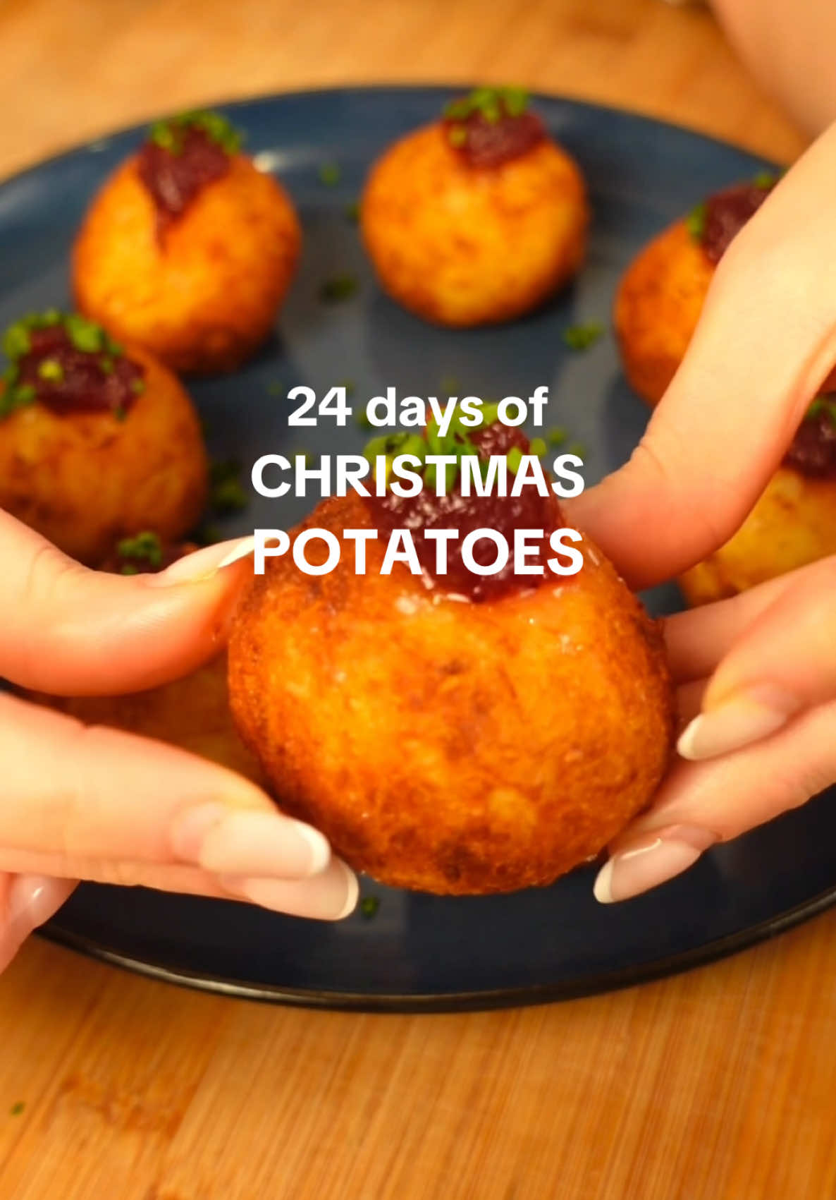 Day 10… cheese-stuffed hash brown balls 😍 recipe below 👇 Ingredients 550g Maris Piper or Yukon Gold potatoes, peeled and halved 1 brown onion, peeled and finely diced 2 tbsp cornflour 75g low moisture block pizza mozzarella, cut into 1 inch cubes 75g brie, rind removed, cut into 1 inch cubes Cranberry sauce, to dip Chives, chopped, to sprinkle Salt and pepper, plus vegetable oil to deep fry Instructions Chuck all of your halved potatoes into a pot of heavily salted cold water. Pop onto the heat and bring to a boil, then turn the heat down slightly and cook for 20 minutes until tender but not falling apart. Drain the potatoes into a colander and place back over the pan you cooked them in. Cover with a clean tea towel and place back over the turned off hob ring to dry for a few minutes in the residual heat. Divide the potatoes into 2/3rds and 1/3rd. Dice the 2/3rds of potato into small cubes and mash the remaining 1/3rd in a bowl. Mix together the diced and mashed potato carefully and stir through the cornflour and a large pinch of salt and pepper. Weigh out each individual hash brown ball to 70g/2.5oz each, then flatten out into large circles. Pop a cube of mozzarella or brie into each one (you should get 4 of each) and roll into balls. Place on a parchment lined baking tray and refrigerate overnight. When you're ready to go, preheat the oven to 200ºc fan/220ºc/420ºf. Heat a deep fat fryer or large pan of oil to 180ºc/350ºf, then deep fry your hash brown balls in batches until golden all over. Drain on kitchen paper then transfer to an oven tray. Bake in the oven for 5 minutes so the cheesy middles are super oozy, then give a healthy sprinkling of salt and top with chives and cranberry sauce. #24ChristmasPotatoes #christmasfood #potatotiktok #potatoes #spuds #carbs