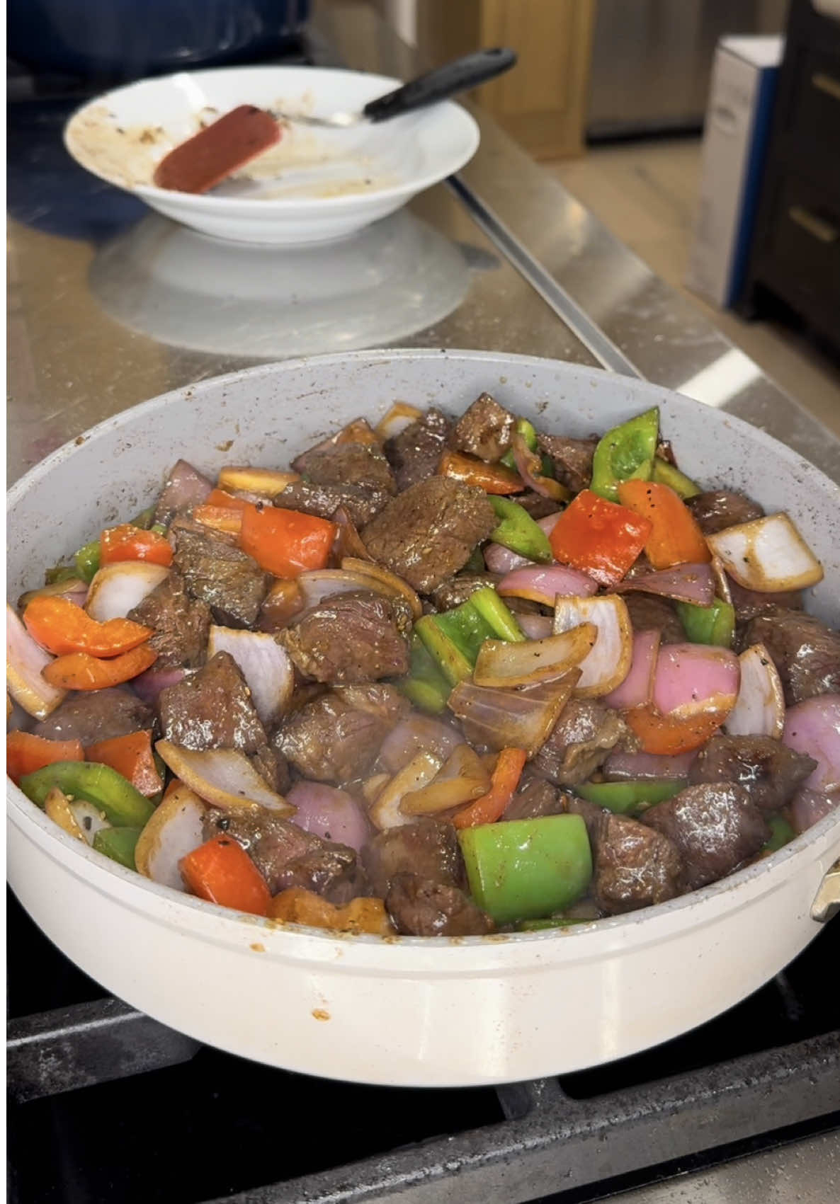 SHAKING BEEF MEAL PREP (BO LUC LAC) MARINADE 1 lb beef 2 TBSP minced garlic 1 tsp sugar 1 1/2 TBSP low sodium soy sauce 1 1/2 TBSP oyster sauce 1 tsp black pepper 1 tsp fish sauce 2 TBSP oil 1/2 tsp baking soda ADDITIONAL INGREDIENTS 2 bell peppers (any color, chopped into bite size) 1 onion (purple or yellow, chopped into bite size) 2 TBSP unsalted butter Salt and black pepper to taste *note: I have 3 lbs of beef in my video. I cooked 1 lb and divided the remaining and froze them. When ready to eat, remove from freezer, defrost and cook according to the below instructions:  INSTRUCTIONS 	1.	Cut your beef into bite size cubes and marinate with all of the ingredients listed under MARINADE. Marinate for at least 10 mins at room temp. 2. Heat up some oil. Once hot, add your beef and cook for ~1 minute un touched so it can form a nice crust. After 1 min, give it a mix and leave it alone to cook untouched for another minute. (Note: dont over crowd your pan.. if you dont, temperature decreases and a crust will not form) 3. Once your beef is cooked, remove from heat 4. In the same skillet, add your onions and cook for 2-3 minutes. 5. Add your bell peppers and season with salt and black pepper. Cook this for 3-5 minutes. 6. Add your beef back in and butter. Cook this until butter has melted  7. Serve with rice.