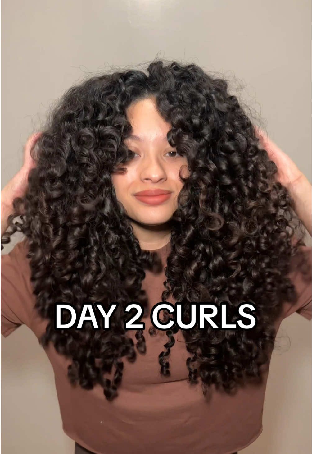 These results for day 2 >>>  Curly hair routine here : @Aveda curls cream + gel. Used the @K18 Hair oil for day 2. Scrunchie is from @Curlfriend Collective ❤️❤️❤️ bonnet from amazon.  #curlyhairtutorial #curlyhairroutine #curlyhair #curlyhaircare #curlyhairtips #longcurlyhair #curlyhaircheck #curlyhairproducts #curls 