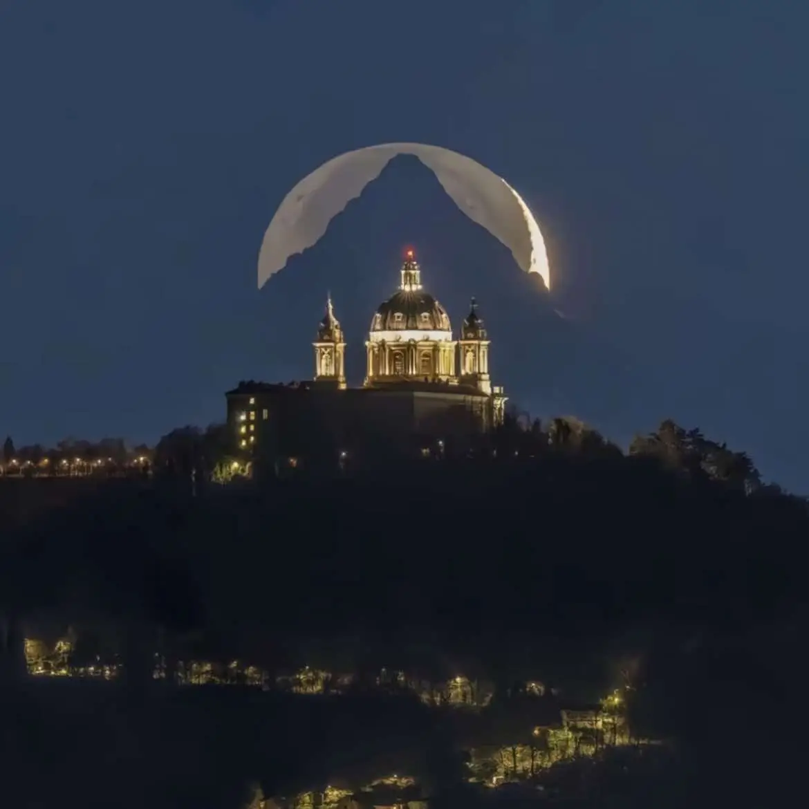 Italian photographer, Valerio Minato, spends 6 years capturing the perfect moon, mountain, and basilica alignment