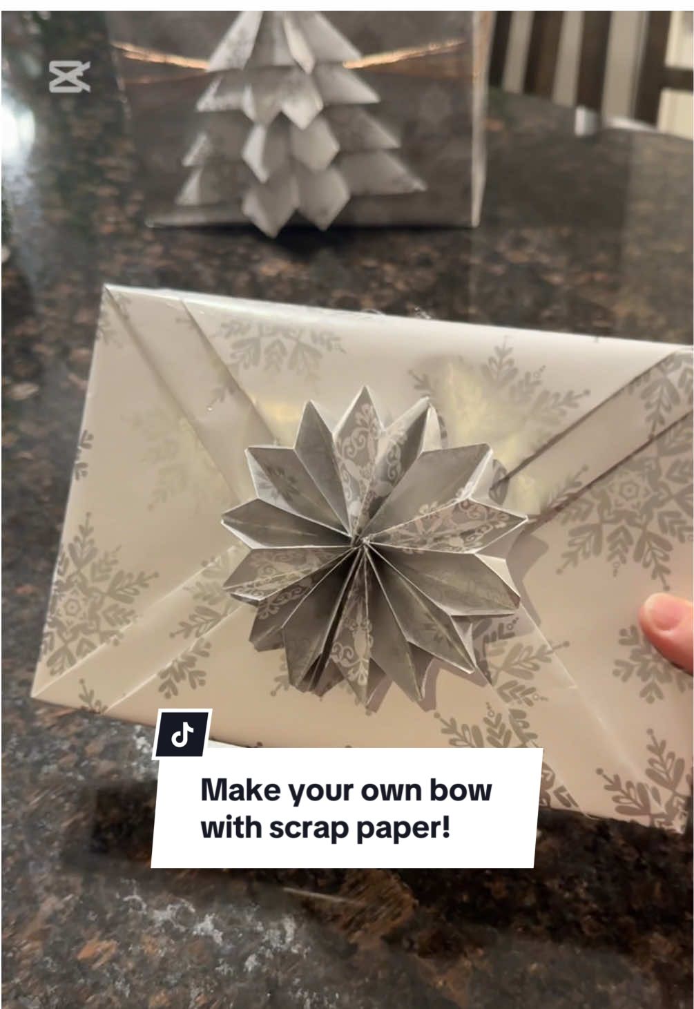 Do you recycle your old Christmas paper?   Here’s a great way to use up all of your scrap paper to make your gifts to look a little sweeter. 2 inches by 20-30 inches is the perfect size!   #wrappingtutorial #christmasgift #giftwrapping #simplewrap #reusereducerecycle #DIYbow  