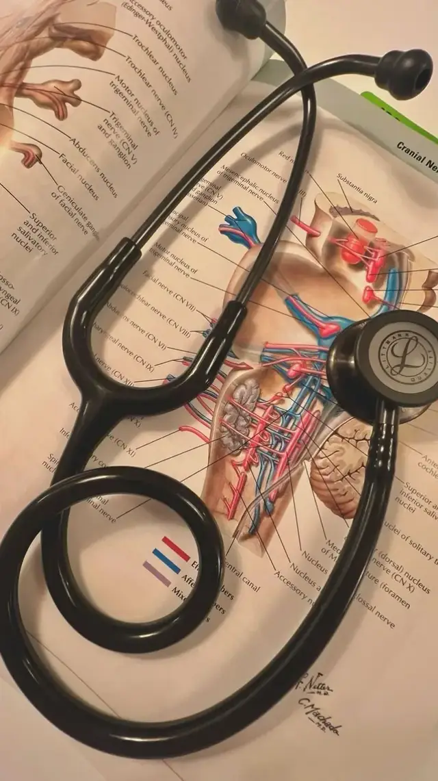 This photo captures a black stethoscope placed on an open medical anatomy book, showing detailed diagrams of cranial nerves and their anatomical pathways. The stethoscope, a key tool for physical examinations, symbolizes the medical profession and dedication to patient care. The open book suggests a study or reference moment, emphasizing continuous learning in medicine. It's likely a reflection of your commitment to understanding complex systems, which aligns perfectly with your role as a pediatrician. #mediacalstudent #1millionaudition #fouryou 