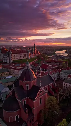 Wawel Castle and Kraków's Old Town at sunset – witness the city’s beauty from a new perspective! 🌅🏰✨ Captured by a drone, this view showcases Wawel Castle 🏯 glowing in the sunset, with more of the Old Town 🏙️ and the serene Vistula River 🌊. The reflections on the water 💧 add an extra touch of magic to the scene, bringing Kraków’s rich history and scenic beauty to life. Ready to take in this unforgettable view? 🌇 Come and see Kraków from above at golden hour! 🇵🇱❤️ Don’t miss more stunning drone shots of Kraków – hit follow and stay tuned! 🚁📸 - Gear & Edit: ✈️ Dji Mini 4 Pro + ND Filter 📐 Edit and color grading from D-Log M to Rec.709: Davinci Resolve - #krakow #drone #sunset #wawelcastle #wawel