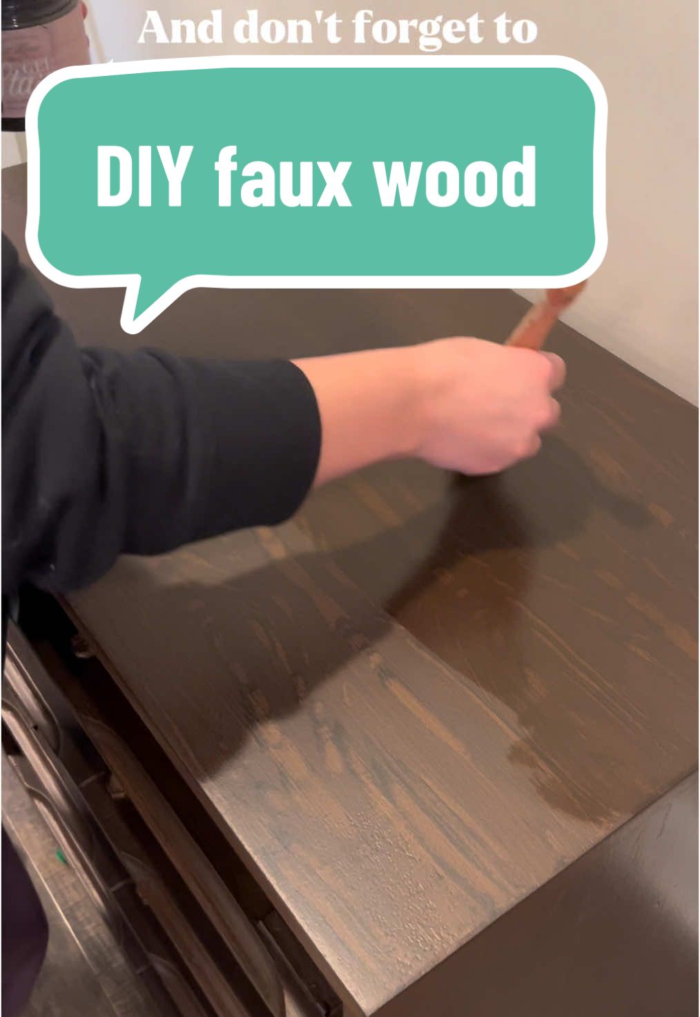 I really wanted to keep this piece mostly wood but the veneer had too much damage. But that doesn't mean you can't still get the wood look! I love doing this trick. I find it works better if you go really dark and create a subtle wood grain to help it look more realistic. Did I pull it off? #DIY #fauxwood #paintedfurniture 