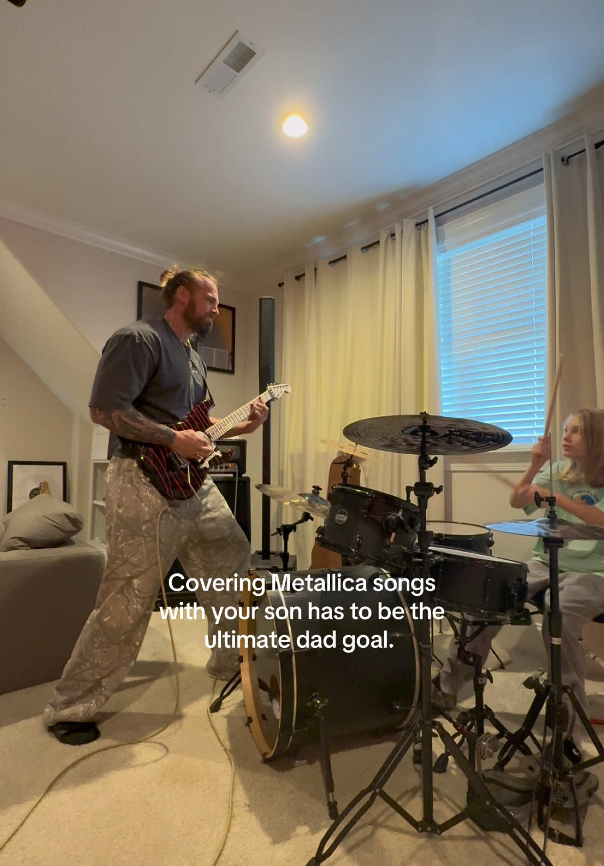 Name the song. 🤷🏼‍♂️ #metallica #heavymetal #guitar #band #dadsoftiktok #fatherson #drummersoftiktok #guitartok 