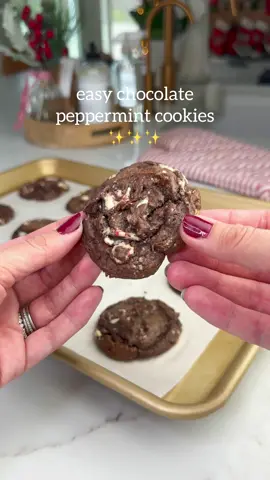 Chocolate Peppermint Cookies 🍫❄️ these only require a handful of ingredients (ones you may already have in the house this time of year) and seriously taste homemade. So if you’re still looking for an easy and delicious cookie to make for the holidays, look no further! Here’s how you make them: INGREDIENTS: - 1 box Chocolate Cake Mix (I used Betty Crocker Super Moist Chocolate Fudge) - 2 eggs - 1/2 c melted butter - 10 x peppermint bark squares, chopped INSTRUCTIONS: - In a bowl, combine cake mix, eggs and melted butter. - Fold in chopped peppermint bark squares. - Scoop dough onto baking sheet lined with parchment paper. - Bake at 350 for 10-12 minutes until edges feel set.  - Remove from oven and allow to set on baking sheet for 5 minutes. - Transfer to cooling rack and allow to cool completely.  - ENJOY! #christmascookies #cookierecipe #holidaybaking #momhacks #HolidayTreats 