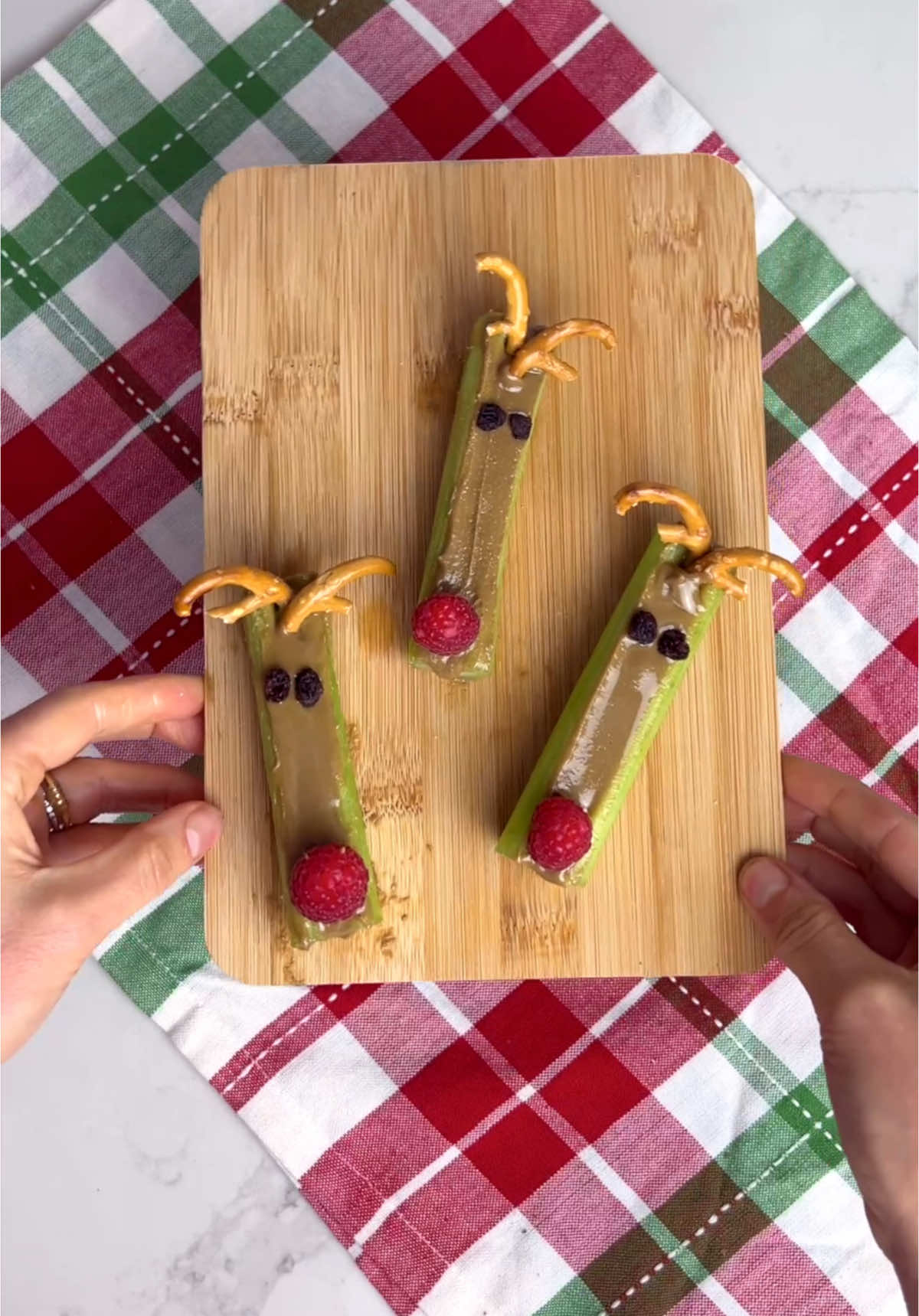 Preschool lunch… but make it holiday. I thought this cute little Rudolph spin on ants on the log was so cute! You can use some butter or anything you want if your school is not free too. My preschooler does not like celery, but he was excited for these and actually tried them. Ended up just eating everything except the celery, but he did take one bite so… 🤷‍♀️😅 #holidaylunchforkids #kidsbentoboxidea #rudolphcelerypeanutbutter #rudolphkidslunch 