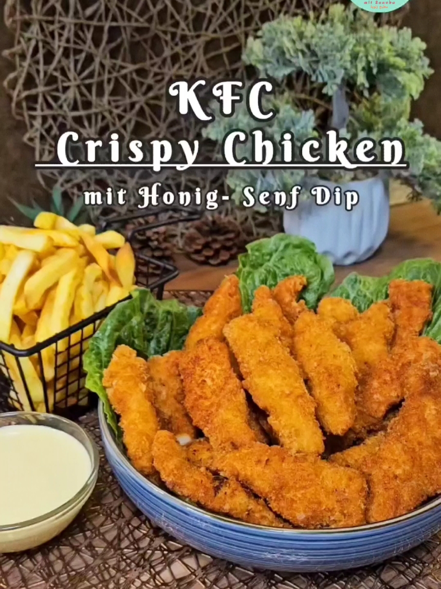 KFC Crispy Chicken mit leckerem Honig-Senf-Dip – So einfach geht's! Zutaten für die Hähnchenstreifen: 1 kg Hähnchenbrust Marinade: 1 Ei 1 TL Curry 1 TL Paprikapulver 1/2 TL Knoblauchpulver 1 1/2 TL Salz 1/4 TL Pfeffer 130 ml Milch 60 ml Mineralwasser (mit Kohlensäure) 120 g Mehl Panade: 500 g Pankomehl oder Paniermehl Zubereitung: 1. Hähnchenbrust in Streifen schneiden. 2. Alle Zutaten für die Marinade in einer Schüssel gut verrühren. 3. Die Hähnchenstreifen in die Marinade geben, alles gut vermengen und abgedeckt mindestens 2-3 Stunden oder über Nacht im Kühlschrank ziehen lassen. 4. Die marinierten Streifen in Pankomehl oder Paniermehl wälzen. 5. In heißem Öl auf mittlerer Stufe goldbraun frittieren. Honig-Senf-Dip: 3 EL Mayonnaise 2 EL Senf 5 EL Honig 2 EL Essig Alles gut verrühren und genießen! 💡 Tipp: Ich habe 3 kg Hähnchenfilet zubereitet und in mehreren Portionen eingefroren – perfekt für den Vorrat! Guten Appetit und viel Spaß beim Nachmachen! Hashtags: #KFC #chickenwings #Foodie #crispychicken #crispy #foodporn #mcdonalds #friedchicken #fastfood #instafood #KFCChicken #instagood #bhfyp #instagram #sanuba #fypシ゚viralシ #fypシ゚ #fyp