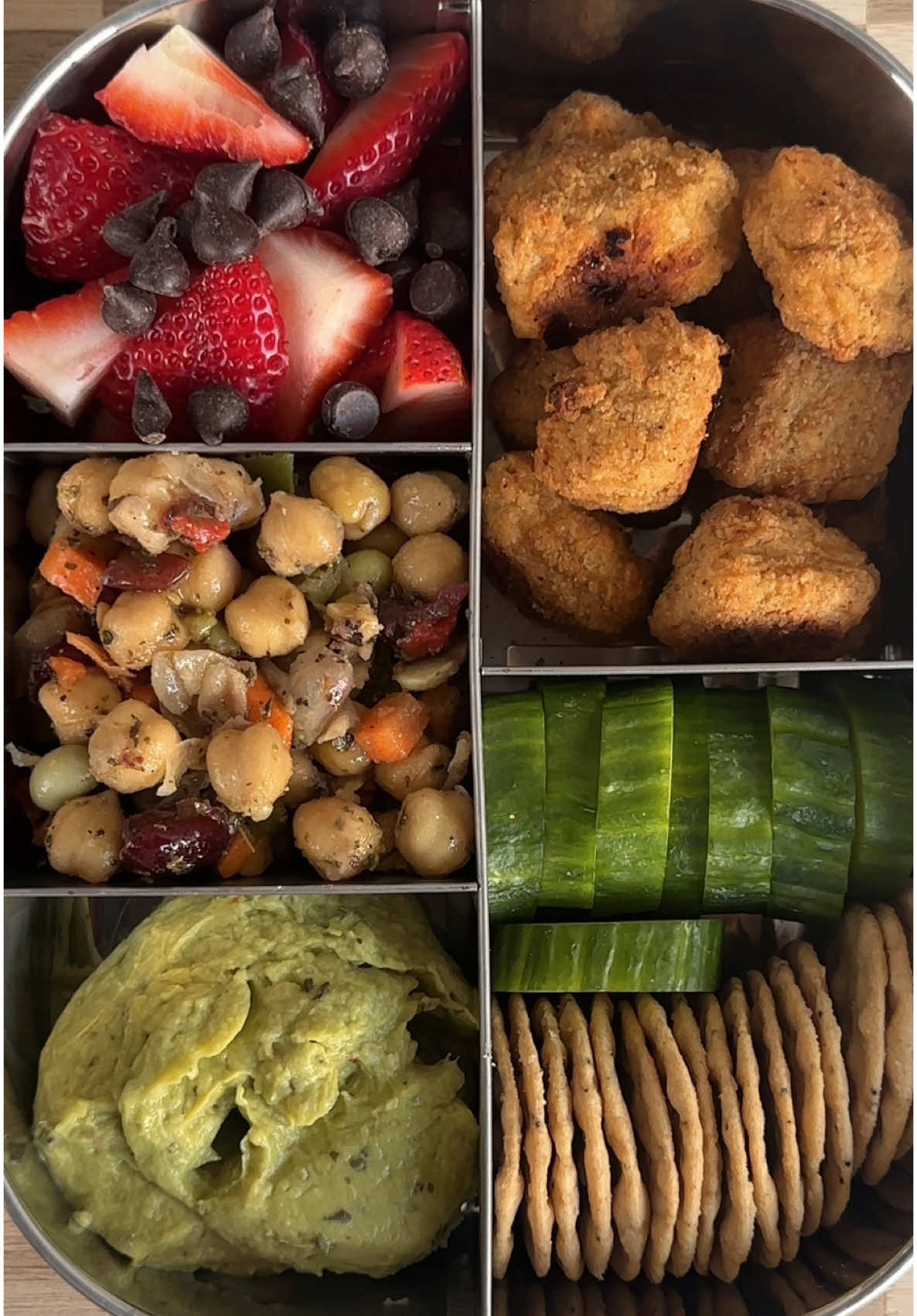 Adult lunchable of the day! You guys wanted a vegan version so here you go!! The Tupperware I use is on my Amazon storefront!  Snack box dEATS: - everything rice crackers   - @Gardein vegan chicken nuggets - guacamole  - @Cedar’s Foods chickpea salad  - strawberries and dark chocolate chips #healthysnack #snackbox #adultlunchables #mealprep 