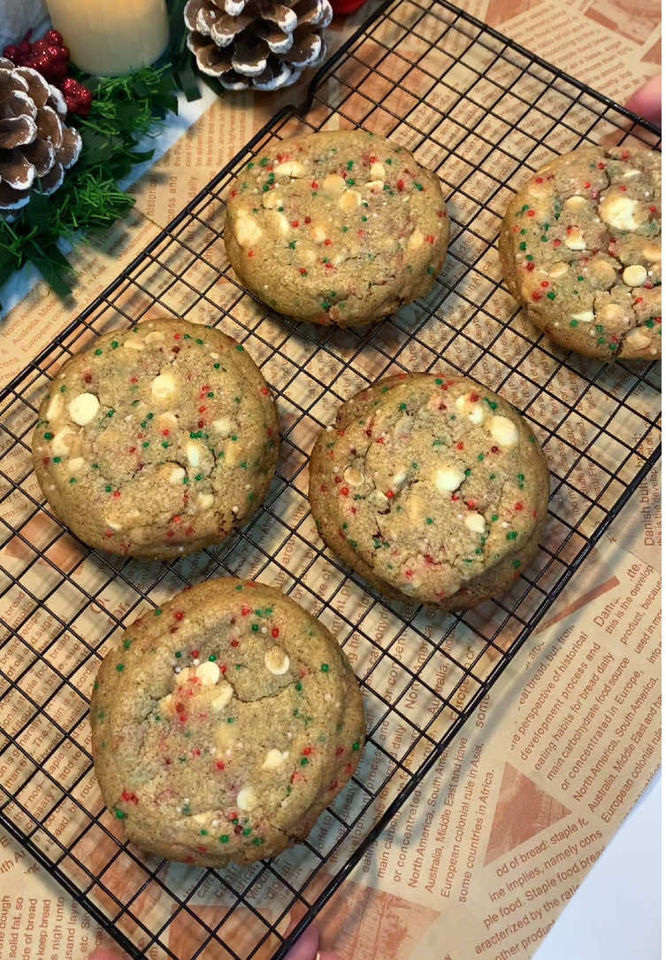 Festive White Choco Chip Cookies  115 g butter  100 g granulated sugar 65 g brown sugar 1 egg  2 tsp vanilla  150 g all purpose flour  1/2 tsp baking soda  150 g white chocolate chips 1/4 cup festive sprinkles  Melt the butter over medium heat, stirring often. Continue cooking until the butter foams and turns golden brown with a nutty aroma.  Remove from heat immediately and pour into a bowl to cool for 10–15 minutes In a mixing bowl, whisk together the brown sugar and granulated sugar. Add the cooled brown butter and mix until well combined. Add the egg and vanilla, whisking until the mixture is smooth and creamy Gradually add the dry ingredients to the wet ingredients, mixing just until combined Gently fold in the white chocolate chips and  sprinkles Cover the dough and refrigerate for at least 1–2 hours or overnight. (Don't skip this step)  Bake at 180C for 9-11 mins.  #christmasbaking #christmasrecipes #christmasbakingideas #bakingrecipe #bakingideas #bakingtiktok #christmascookies #christmascookie #fypage #bakingtherapy #christmasdesserts 