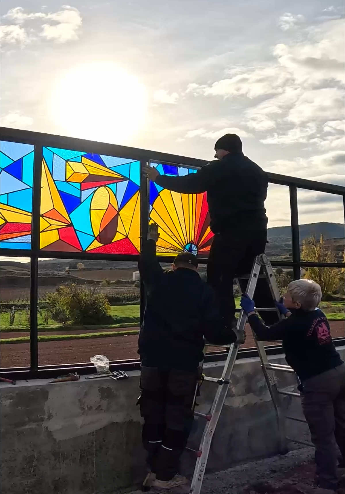 🔥 From Wall to Monument : An 8m² Stained Glass Graffiti Art Project 🔝 . 🔥  “Cromatismo del Camino” is an artistic project that revitalizes the tradition of stained glass, placing it within the modern context of the Camino de Santiago in Ventosa, La Rioja. This project merges the aesthetics of contemporary graffiti with traditional stained glass techniques to create a piece that dialogues with the landscape and cultural history of the path. The use of glass not only captures and transforms light, symbolizing clarity and spiritual renewal for pilgrims but also allows the artwork to dynamically interact with its surroundings, changing with the variations in natural light throughout the day and seasons. Besides its aesthetic beauty, the work utilizes vibrant colors and local symbols such as vineyards and the shell of Santiago, inviting visitors to an experience of reflection and visual dialogue. By incorporating a contemporary stained glass piece into this historic route, “Cromatismo del Camino” not only physically guides pilgrims but also invites them on a personal and cultural discovery journey, echoing the traditional spiritual narrative of the cathedrals along the way through a new artistic lens. . Full video process on my YouTube Channel . Do you this new adventure ? Leave me your opinion in the comments below ⬇ . . 🔥 Thanks to: @1kmdearteventosa   . . #throwup #throwups #throwupz  #graffitiartist #graffitistyle #resak #throwupsonly #resaksgraffiti #graffitibombing #graffitiart #resacs #graffiti #grafiti #graffiti #graffitiproyect #stainedglass #stainedglassart #stainedglassartist #graffitistainedglass #artpoyect #art #artgallery #artist #graffitiartist 