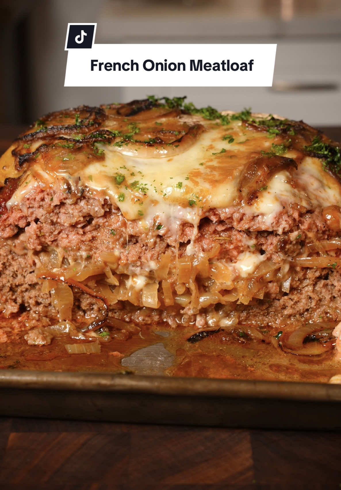 French Onion Meatloaf 🧅  Recipe ⤵️⤵️⤵️ I’m using @Bearmountain BBQ pellets (Chef’s Choice) I have been using Bear Mountain Pellets for about 5 years now and they are the best in the GAME! You can now find these at Walmart for a GREAT PRICE! 💨 Ingredients:  5 lbs Ground Beef  2 Cups Panko Bread Crumbs 4 Yellow Onions 5 Tbsp Butter 6 Tbsp Worcestershire  2 Eggs 2 Tbsp Italian Seasoning 2 Tbsp Smoked Paprika  4 Garlic Cloves 1 lb Gruyère Cheese 2 Tbsp Flour 1 Cup Beef Stock 2 Tbsp Salt 2 Tbsp Pepper How to:  1. In a Pan on medium to high heat Sauté & Caramelize Chopped Onions with 3 Tbsp Butter, 3 Tbsp Worcestershire, and Salt for about 20 minutes  2. Set Caramelized Onions aside 3. Mix Ground Beef, Panko, 3 Tbsp Worcestershire, Eggs, Italian Seasoning, Smoked Paprika, Salt, and Pepper  4. Form your Meatloaf and create a pocket in the center to add in your Caramelize Onions and shredded Gruyère Cheese. Top with the Meat Mixture and add to the top more Cheese and Onions 5. In the Smoker at 350 degrees until internal temperature is 160 degrees (mine took 1 1/2 hours) 6. Top with Parsley and Gravy Bear Hands Cleaver @THE COOKING GUILD  Smoker @GMG  #smoked #french #onion #meatloaf #Recipe  #ideas #bearmountainbbq 