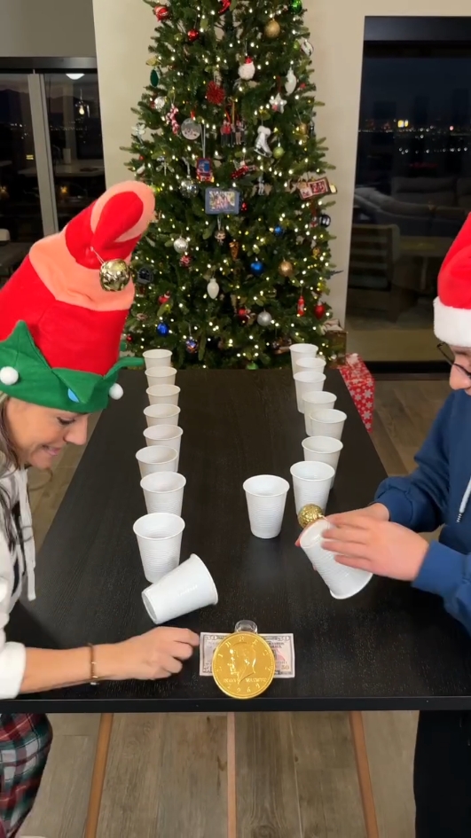 Grab, Throw, Catch, repeat!  Ornament Edition 🪩 Getti and Zander race to see who can flip all the cups and catch all the ornaments without dropping them. #challenges #holidaygames #ornaments #familygames #christmasgames #Christmas #games #partygames🎉 #viral #foryou 