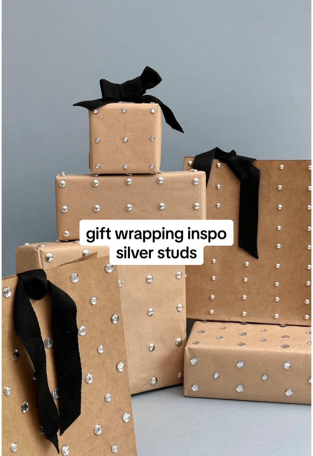 shoutout to the khaite elena bag for inspiring me to put studs all over my wrapping #giftwrap #wrappinggifts #wrapping #giftwrapping 