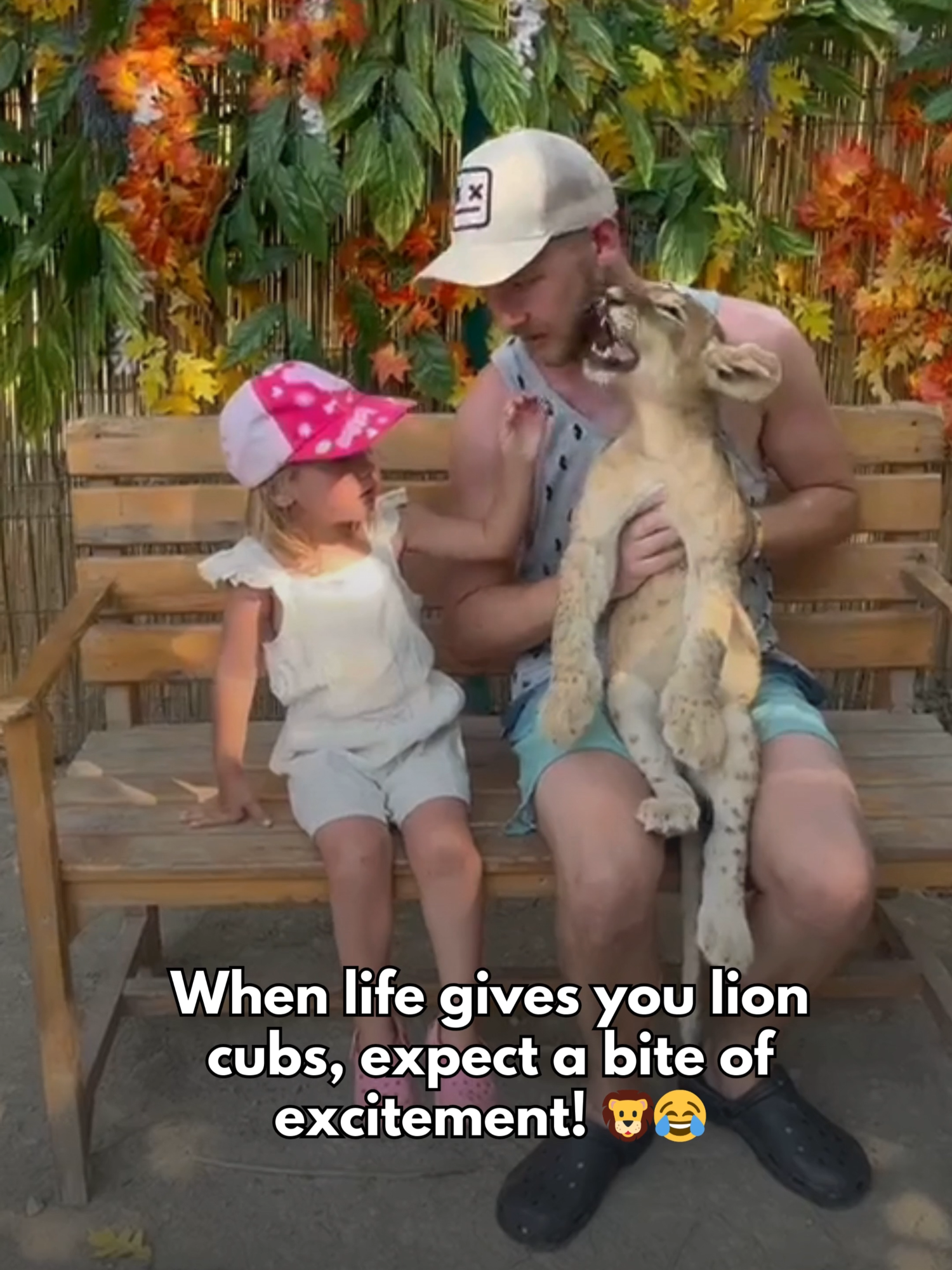 When life gives you lion cubs, expect a bite of excitement! 🦁 . Be aware and exercise caution when interacting with wild animals. #Lion #Cub #lioncub #photo #gonewrong #ouch #heisfine #ohno #wooglobe #wooglobeviral #wooglobefails