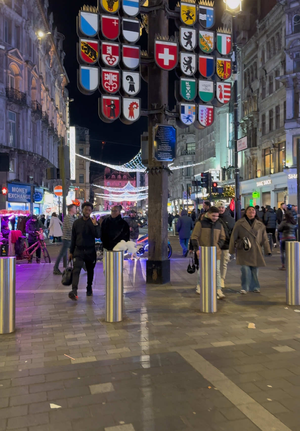 Strolling through Coventry Street. London nightlife, Christmas decorations, and a vibrant Atmosphere.  #london #londra #visitlondon #londoncity #londonwalks #londonlife #citylife #christmas #walk #foryoupage #fyp 