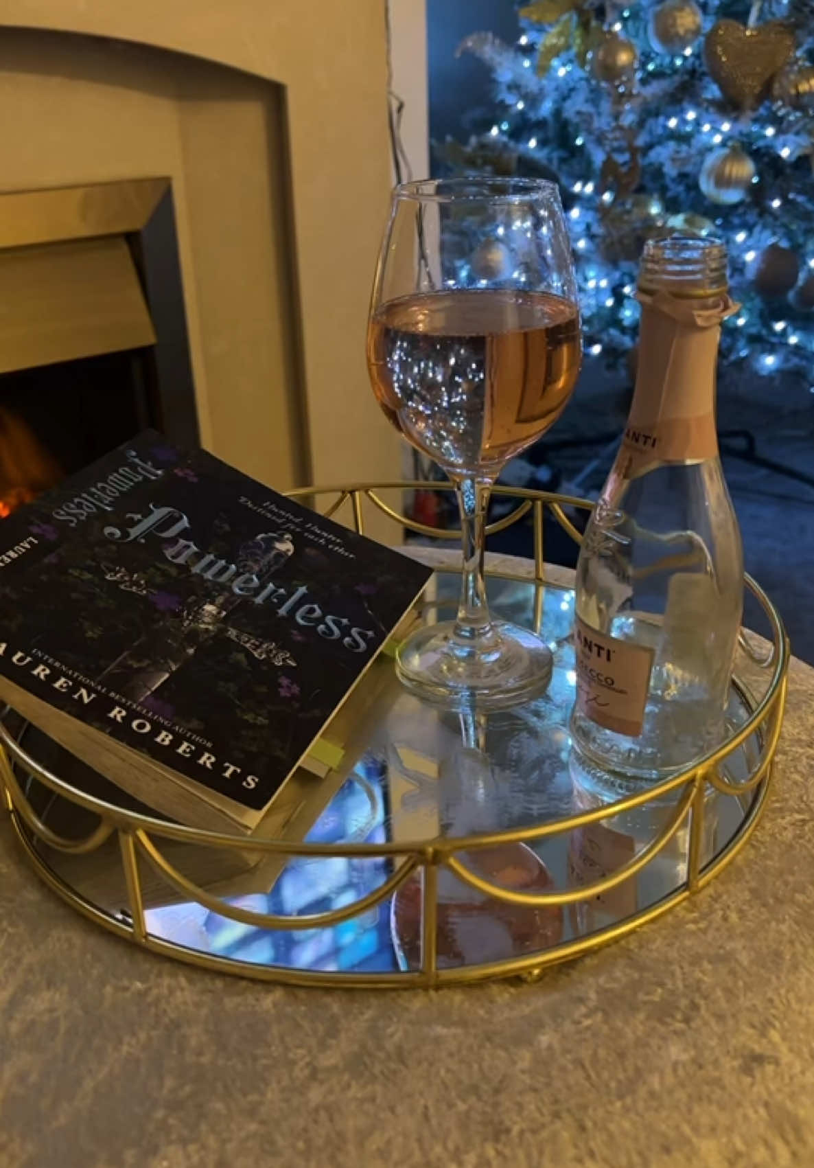 #StopMotion pink prosecco and relax time , currently on page 166 of powerless by lauren roberts and really enjoying it #BookTok #books #bookworm #powerlesslaurenroberts #bookish #fyp #bookish #bookishtiktok 