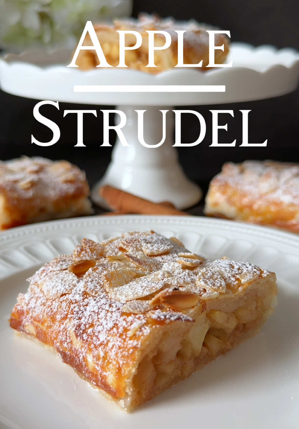 Apple Strudel Recipe 🍎🤍 This apple strudel with puff pastry is delightfully simple to prepare and incredibly delicious. The almond flakes add a beautiful touch and extra crunch, making this recipe both tasty and visually appealing! 🥰 📝 Ingredients: • 1 sheet of puff pastry (rectangular, from the refrigerated section) •	3 medium apples (e.g., Elstar or Boskop) •	30 g (2 tbsp) brown sugar •	1 tsp cinnamon •	2 tbsp chopped almonds •	2 tbsp ground almonds •	2 tbsp lemon juice •	1 egg yolk + 1 tbsp milk (for brushing) •	Almond flakes (optional, for topping) • ⁠You can also add about 2–3 tablespoons of raisins to the apple filling for an extra layer of sweetness. • Powdered sugar (for dusting)⁠ 🤍 Instructions: 1.	Preheat the oven to 200°C (390°F) top and bottom heat, or 180°C (350°F) fan-assisted. Line a baking tray with parchment paper. 2.	Peel, core, and dice the apples into small pieces. Mix them in a bowl with brown sugar, cinnamon, lemon juice, and chopped almonds. 3.	Roll out the puff pastry on a large piece of parchment paper. Sprinkle the ground almonds evenly over the pastry to prevent it from becoming soggy from the apple juices. 4.	Place the apple mixture on the lower third of the pastry, spreading it evenly. Leave a 2–3 cm border on the sides. 5.	Carefully roll the pastry up from the long side, using the parchment paper to help. Place the seam side down and tuck in the ends to seal the filling. 6.	Brush the strudel generously with the egg yolk and milk mixture. If desired, sprinkle with almond flakes for an extra crunch and decorative finish. 7.	Transfer the strudel to the prepared baking tray and bake in the preheated oven for 25–30 minutes until golden brown. 8.	Let the strudel cool slightly, then dust with powdered sugar and slice into portions. 🤍 Serving suggestion: Enjoy warm or cold, paired with vanilla sauce, a scoop of ice cream, or whipped cream. Enjoy! 🥰