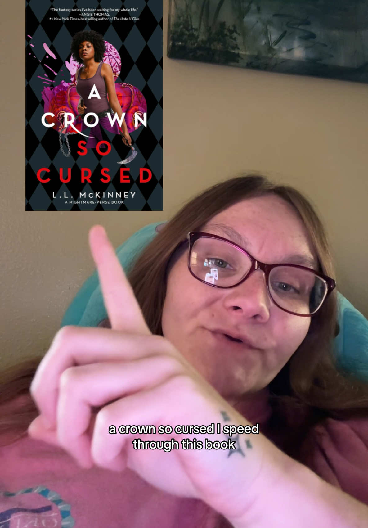 A Crown So Cursed By L.L. McKinney. I loved this book. Video Description: A toothless white lady laying in bed. She has long brown hair and purple glasses. She is talking to the camera about a book she finished. She has a picture of the book posted in the corner of her video. #bookworm #BookTok 