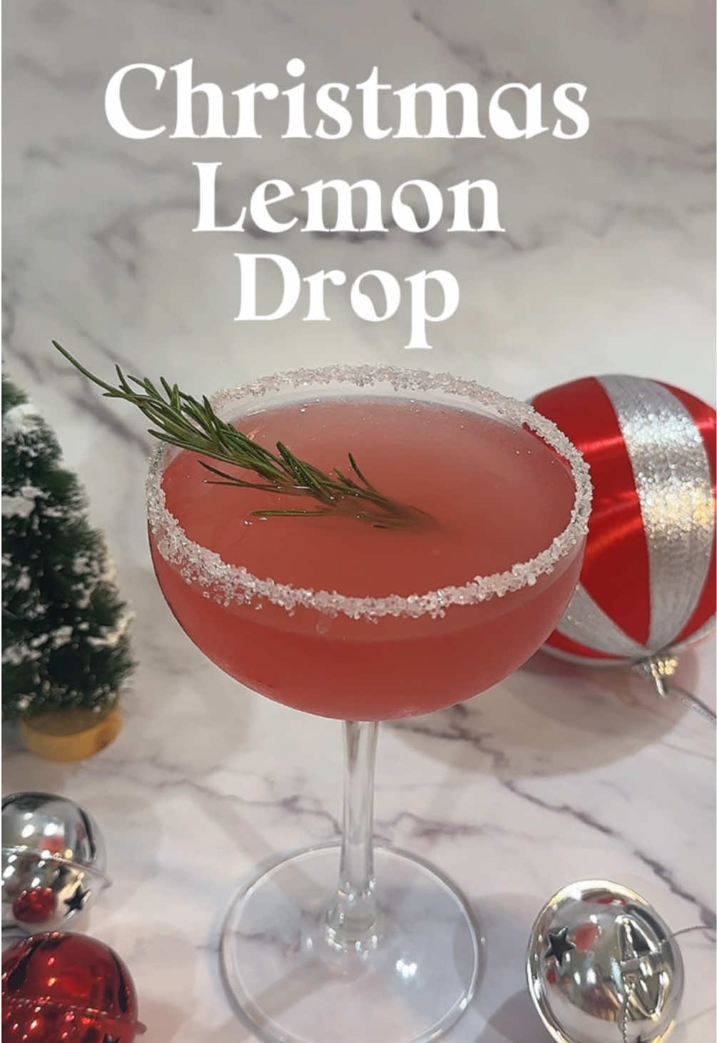 12 DAYS OF CHRISTMAS DRINKS 🎄✨ Day 7: Christmas Lemon Drop 🍋  A lemon drop with a splash of cranberry juice perfect for a refreshing Christmas cocktail 🍹 45ml vodka 20ml triple sec 45ml lemon juice 30ml cranberry juice Simple syrup Glass rim: lemon juice and sugar  Garnish: Rosemary Add all liquids to a shaker over ice Shake well Use a lemon wedge to add some lemon juice to the rim of your glass and then dip in sugar  Strain into glass  Garnish with a sprig of rosemary Enjoy!  #lemondrop #cranberrylemondrop #christmascocktails #christmasdrinks #christmas #cocktailrecipe #drinktok #cocktails30sec 