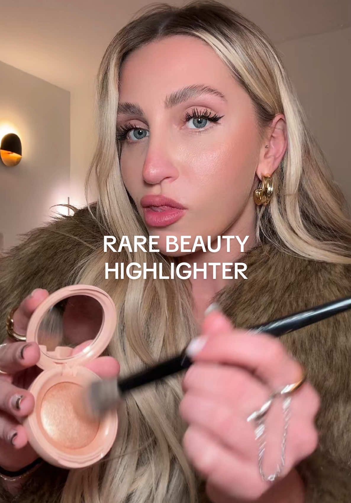 Favorite things holiday party gift idea - @Rare Beauty Rare Beauty highlighter in the shade Flaunt #highlighter #rarebeauty #favoritethings #giftideas #giftguide 