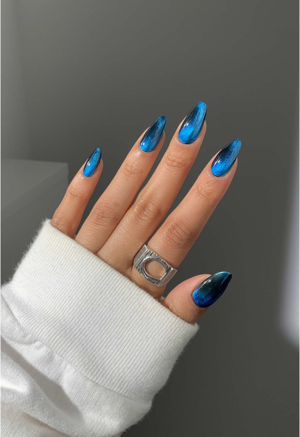 cant believe this is regular polish, the cateye effect is unreal 💙 ib @Sarah  using @essie licorice, @Lights Lacquer starfall, & @Cirque Colors indigo jelly (discount codes in my bio)* Ring is @Luv Aj  _____ *affiliate #glassnails #cateyenails #magneticnails #bluenails #nailinspo #winternails #decembernails 