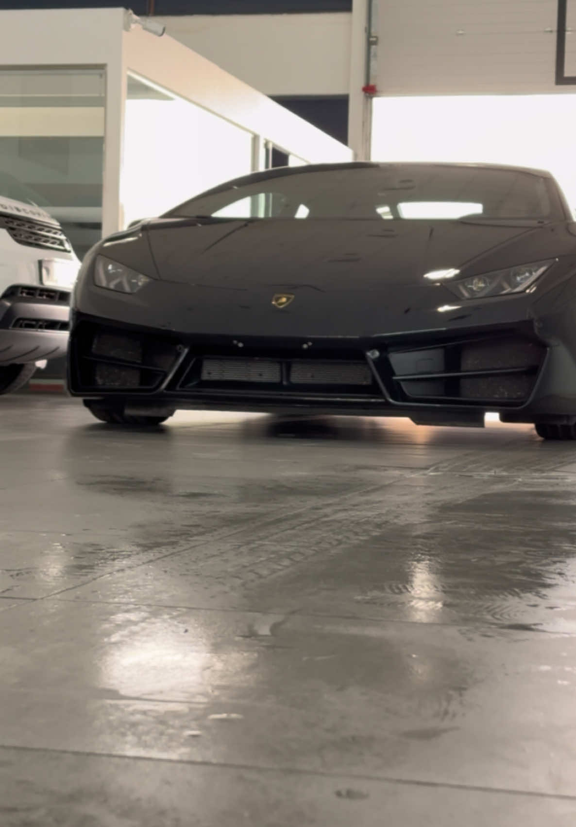 Just spotted this sleek black Lamborghini rolling out of the showroom! 😎💨 Talk about leaving in style. #tiktokdubai🇦🇪 #tiktokuae #carspotting #lamborghini #luxurylifestyle #cargoals 