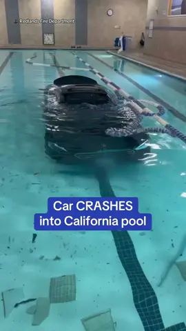 A California driver crashed through a wall and went into the pool of a fitness center. Firefighters in Redlands captured the aftermath of what they called a ‘unique motor vehicle accident’ that happened last week. The driver, the only person inside the car, escaped the vehicle with only minor injuries. The pool was unoccupied at the time of the incident. 🎥 Instagram / Redlands Fire Department #driving #california #accident #pool 