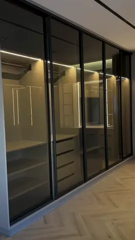 Step into elegance ✨ A walk-in closet designed with stunning wooden cabinetry, sleek glass doors, and soft track lighting that brings timeless sophistication to your daily routine. Where organization meets luxury. 🌿 #ClosetGoals #LuxuryLiving Sinai kitchen Cabinet Maker in Markham, Ontario 📍87 Steelcase Rd. W. unit1-2 Call or text message us: 📞905-475-5829 📞905-477-3852 M-F 9:30-6:30 Sat 10-6 Sun Closed www.SinaiKitchen.com SinaiKitchen@gmail.com #torontodowntown #richmondhillhomes #markhamhomes #richmondhillga #richmondhillontario #torontomom #torontohouses #markhammoms #torontomoms #多倫多 #多倫多美食 #downtowntoronto  #torontodowntown #torontohomedecor #kitcheninspiration #kitchenremodel  #torontolife #torontorealestate #torontohomebuilders #torontohomes #torontohome #cabinetry #cabinet #cabinets #torontokitchen #kitchenreno #kitchendecor #kitchendesign #kitchencabinets 