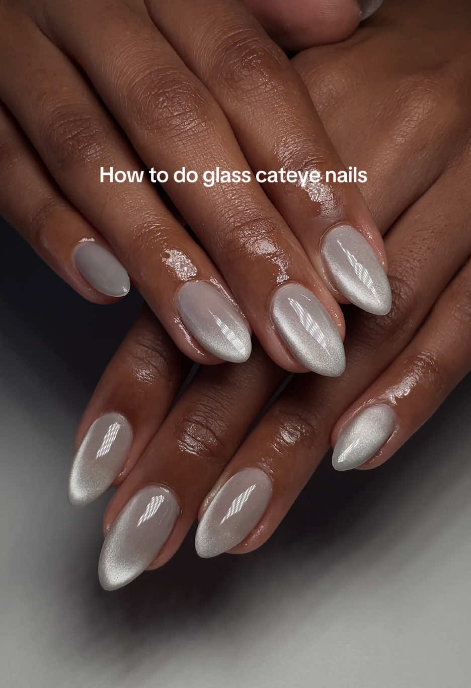 Tutorial on how I achieved this silver cateye effect glass nails ❄️ I used @dndgel perfect nude for my base color but any nude color can work for this look! If you have any questions, please let me know 💗#winternails #holidaynails #christmasnails #festivenails #nailtransformation #nailtutorial #dallasnailtech #planonails #planonailtech #dallasnails #cateyenails #cateyenailtutorial 