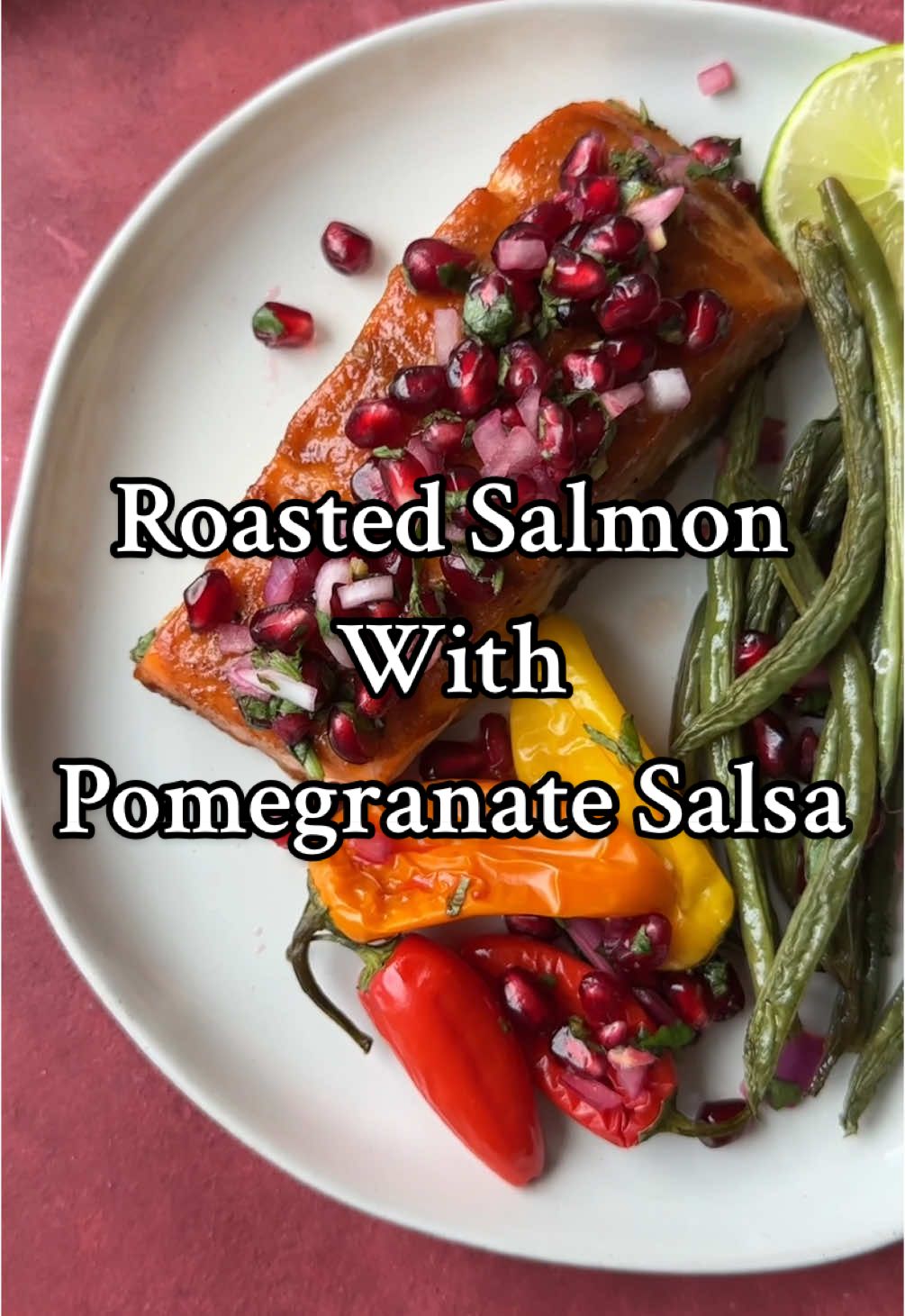 Roasted salmon with pomegranate salsa Salmon and Veggies ▢ 3 tbsp Olive oil, for marinade ▢ ½ tsp Garlic powder ▢ 1 1/2 tsp Salt, for marinade ▢ 1 tsp Black pepper, for marinade ▢ 1 tsp Paprika ▢ 2 tbsp Pomegranate molasses ▢ 4 fillets Salmon, 6 oz. each ▢ 1 lb Green beans ▢ 6-8 small Peppers ▢ 2 Red onions ▢ 2 tbsp Olive oil, drizzle on veggies in the pan Pomegranate Salsa ▢ 1½ cups Pomegranate arils ▢ ½ Red onion, finely diced ▢ ½ cup Cilantro, chopped ▢ 1 Lime, juiced ▢ 1 tsp Salt Instructions  Preheat the oven to 400 degrees F and coat a baking sheet with cooking spray. Mix 1 tablespoon of the olive oil with garlic powder, 1 teaspoon salt, 1/2 teaspoon pepper, paprika, olive oil, and pomegranate molasses in a bowl. Place the salmon fillets on the sheet pan. Brush the mixture evenly over the salmon fillets. Spread the green beans, small peppers, and red onions on the sheet pan around the salmon. Drizzle with 2 tablespoons olive oil olive oil, 1/2 teaspoon salt, and 1/2 teaspoon pepper. Roast in the oven for 20-25 minutes, until the salmon is cooked through and vegetables are tender. While the salmon roasts, make the pomegranate salsa by mixing the pomegranate arils, finely diced red onion, chopped cilantro, lime juice, and salt in a bowl. Transfer the roasted salmon and vegetables to a platter. Spoon the fresh salsa generously over the top and serve.