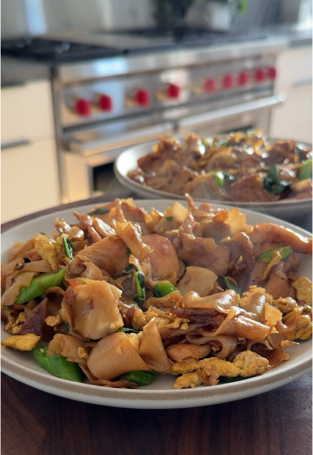 The end when it all goes crashing down 🥲 Chicken pad see ew✨ Chicken + Marinade:▪️8 oz. Boneless Skinless chicken breast, sliced in thin bite sized pieces▪️1 Egg White▪️1 tsp Cornstarch▪️1 Tbsp Soy Sauce (regular, not dark)▪️1/4 tsp Pepper▪️ Sauce:▪️2 Tbsp Oyster Sauce▪️1 Tbsp Dark Soy Sauce (or sub regular)▪️1 Tbsp Sugar▪️1 tsp Fish Sauce▪️ Stir Fry:▪️16 oz. Fresh Wide Rice Noodles (or 8 oz. Dry Rice Noodles)▪️3 Tbsp Avocado Oil, divided▪️2 Eggs▪️3 Cloves Garlic, finely chopped▪️4 Stems Gailan (5 oz.) or 2 Baby Bok Choy, sliced at an angle in thin pieces▪️1 Tbsp Distilled White Vinegar or Rice Vinegar▪️ 🌱Vegan Modification: Sub in extra veggies (or tofu) for chicken, vegan oyster sauce for oyster sauce, and leave out the fish sauce 1️⃣ Marinate the chicken: Place the sliced chicken in a bowl with the egg white, cornstarch, soy sauce, and pepper. Mix and marinate in the fridge for at least 15 minutes; this will tenderize the chicken. 2️⃣ Make the sauce: In a small bowl, mix together the oyster sauce, dark soy sauce, sugar, and fish sauce. Set aside. 3️⃣ Separate the fresh noodles by rolling the individual stacks against a cutting board with your hands and then pulling them apart with your fingers. Set aside. (If you’re using dry noodles, boil them according to package directions then drain, rinse under cool water, and toss in oil to prevent them from sticking). 4️⃣ Preheat a wok (or large pan) over medium high heat and add 1 Tbsp oil. Add the chicken and stir fry for 3-4 mins until just cooked through, then remove from the wok. 5️⃣ Add the eggs, scrambling them with your spatula until cooked through, then add 1 Tbsp more oil along with the gailan and garlic. Stir fry 1-2 mins until gailan is bright green and slightly tender then remove all ingredients from the wok. 6️⃣ Add 1 more Tbsp oil along with the noodles. Sear the noodles in one layer for 2-3 mins until they get a char, then add the sauce and stir fry for another 1-2 mins until evenly coated. 7️⃣ Add the chicken, egg, and veggies back in and stir fry 1-2 more mins until heated through. Turn off the heat, stir in the vinegar, and enjoy! ⏲20 minute prep time + 15 minute cook time Recipe serves 2-3 people For all recipes delivered to your inbox weekly (w/ printable PDFs) + access to the searchable recipe archive, subscribe to my newsletter via the link in my bio 😘 . #recipetok #EasyRecipes #padseeew #maxiskitchen #recipeideas #healthyrecipes 