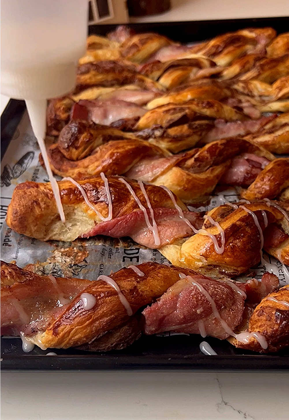 “Discover the perfect balance of sweet and savory with these irresistible Cinnamon Bacon Swirl Twists! Buttery cinnamon pastry meets crispy streaky bacon in a truly delightful combination of flavors. Perfect for any occasion!” Ingredients: 	•	1 tube ready-made cinnamon swirl pastry dough 	•	6–8 strips of streaky bacon Instructions: 	1.	Preheat your oven to the temperature specified on the cinnamon swirl pastry package. 	2.	Unroll the cinnamon swirl pastry dough onto a clean surface or cutting board. Spread the cinnamon filling evenly across the dough, following the package instructions. 	3.	Cut the dough into 6 equal strips. For each strip, unroll it slightly and fold over once. 	4.	Place one strip of bacon along the length of each cinnamon pastry strip. 	5.	Wrap the bacon around the pastry strip from top to bottom, securing it gently. Repeat for all strips. 	6.	Twist each bacon-wrapped pastry to create a spiral effect. 	7.	Arrange the twists on a baking sheet lined with parchment paper, leaving space between each one. 	8.	Bake according to the cinnamon swirl pastry package instructions, or until the twists are golden brown and fully cooked. 	9.	Let the twists cool slightly, then drizzle with icing for a touch of sweetness before serving. These Cinnamon Bacon Twists are a fun and easy treat that perfectly combines the warmth of cinnamon with the salty crunch of bacon. They’re sure to be a hit at parties, holiday gatherings, or as a unique snack. #foryoupagе #christmasfood #boxingday #swirls #bacon #bacontime 