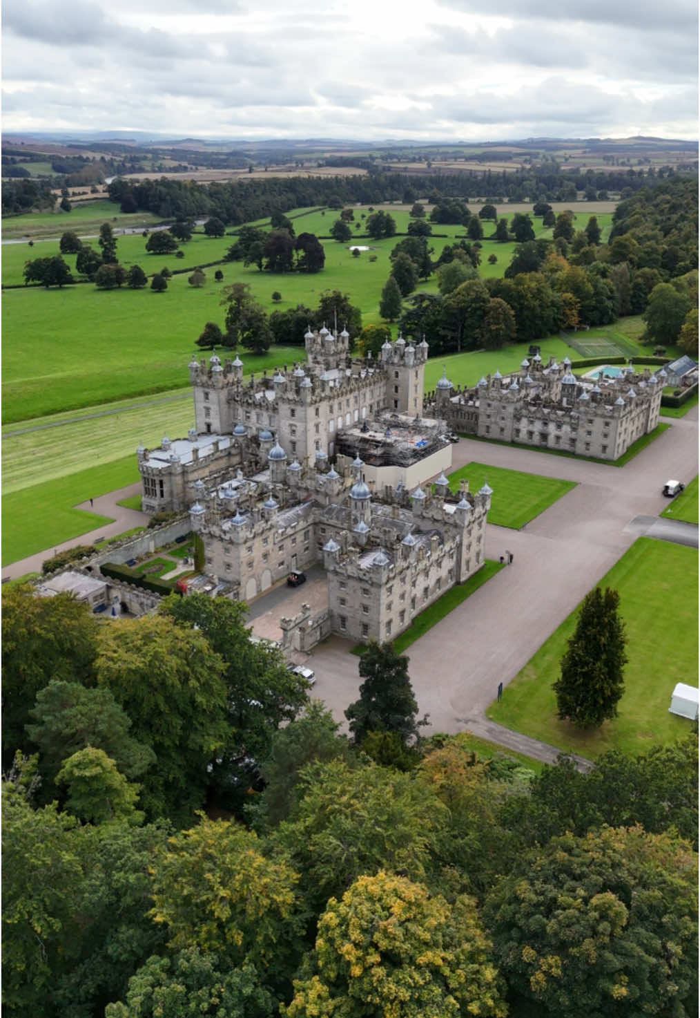 Floors Castle is the largest inhabited house in Scotland and is home to the Duke of Roxburghe. It was opened to the public by the 10th Duke in 1977. The house, as it stands today, is the product of two main phases of construction. The first, constructed between 1721 and 1726 for the 1st Duke, was from architect William Adam, and was perhaps inspired by an original design from Sir John Vanbrugh. Though Broxmouth Park, near Dunbar, seems to have been the main family residence, Floors took precedence after 1730, with the 1st Duke’s mother leading the way by moving here permanently. The stately Georgian house was constructed on a natural terrace overlooking the Tweed, looking directly south across the river to the ruins of the once mighty Roxburgh Castle on its mound, dominating the local landscape. Floors is clearly visible from the main river crossing into the town of Kelso, its distinctive sandstone façade making it stand out. The grandeur of the house and its setting prompted Sir Walter Scott to declare Floors, ‘a kingdom fit for Oberon and Titania to dwell in’. During the time of the 6th Duke, between 1836 and 1847, the Edinburgh architect William Playfair brought the original building into harmony with its landscaped park by grafting on a silhouette, as well as a number of extensions, interior redevelopments and the coach port, allowing visitors to alight from their conveyances sheltered from the elements. Following the marriage of the 8th Duke to wealthy American real estate heiress, Mary Goelet, in 1903, the castle underwent another transformation, with its Victorian interiors being lavishly remodelled. A treasure trove of artwork, tapestries, porcelain and furniture followed, with many of the state rooms being transformed to suit their new contents.  #Scotland #castle #scottish #fyp #visitscotland #scotlandtiktok #scottishtiktok #scotlandtravel #lovescotland #explorescotland #history #castlesofscotland #explore #beautifuldestinations #scottishborders #fy #scotlandforever #castles 