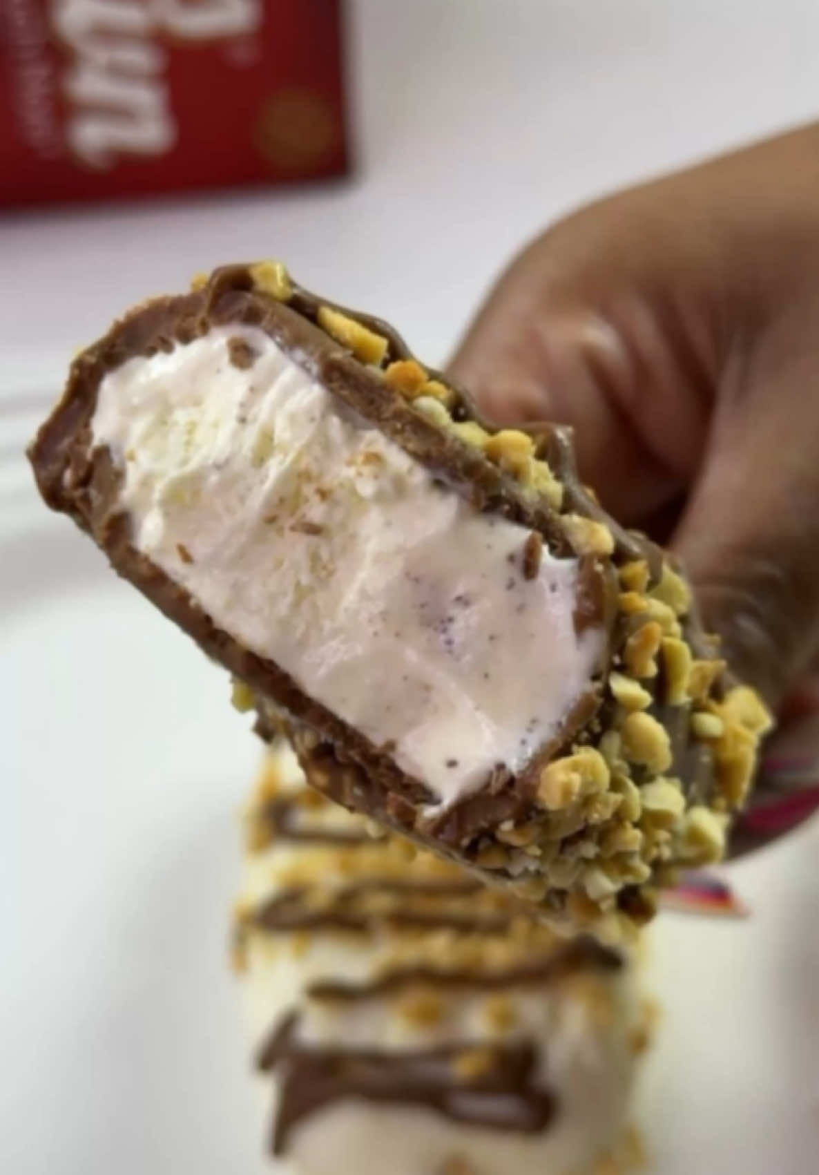 Chocolate Ice Cream Pops ​ Ingredients   4 tbsp. Ellis Brown Creamer (dissolved in 2 cups of hot water) 2 tbsp. cornflower 200g condensed milk 1 tsp. vanilla essence 150g dark milk chocolate  150g white chocolate 1 tbsp. crushed peanuts 3 chocolate biscuits (crushed) 1 tsp. coconut oil ​ Method  ​ In a saucepan  over medium-low heat, pour Ellis Brown creamer that is dissolved in hot water add cornflower, condensed milk, vanilla essence, bring the mixture to a boil, stirring occasionally then add and crushed chocolate biscuits and fold everything together. Remove from the stove, pour into a jug and allow it to cool. Pour into the ice cream silicone moulds once they have cooled off and insert wooden stick to each…and freeze for 5-6 hours.   Once the ice cream pops have frozen/hardened, melt chocolate with coconut oil, allow to cool for 2 minutes,  Remove ice cream pops from the moulds and quickly dip them one at a time into the melted and cooled chocolate. Decorate with nuts  and drizzle with chocolate Freeze until ready to serve.   #MoreMeals #MoreMugs #MoreMemories #SoMuchMore #Ad @ellisbrowncreamer