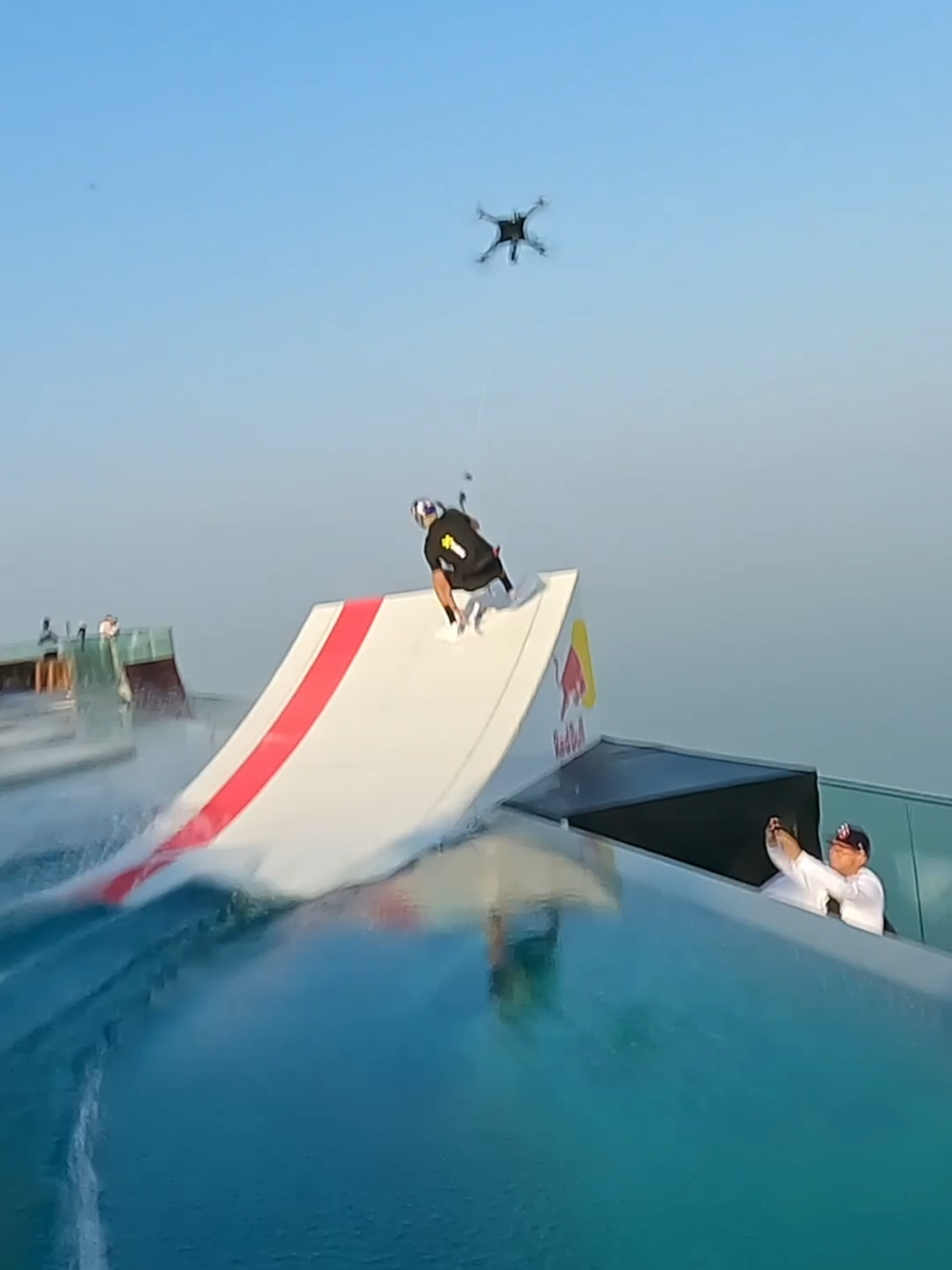 because jumping *into* the pool is so mainstream 😏 🏄‍♂️: Brian Grubb  🤝: @prada #redbull #givesyouwiiings #PradaLineaRossa #wakeskate #basejump