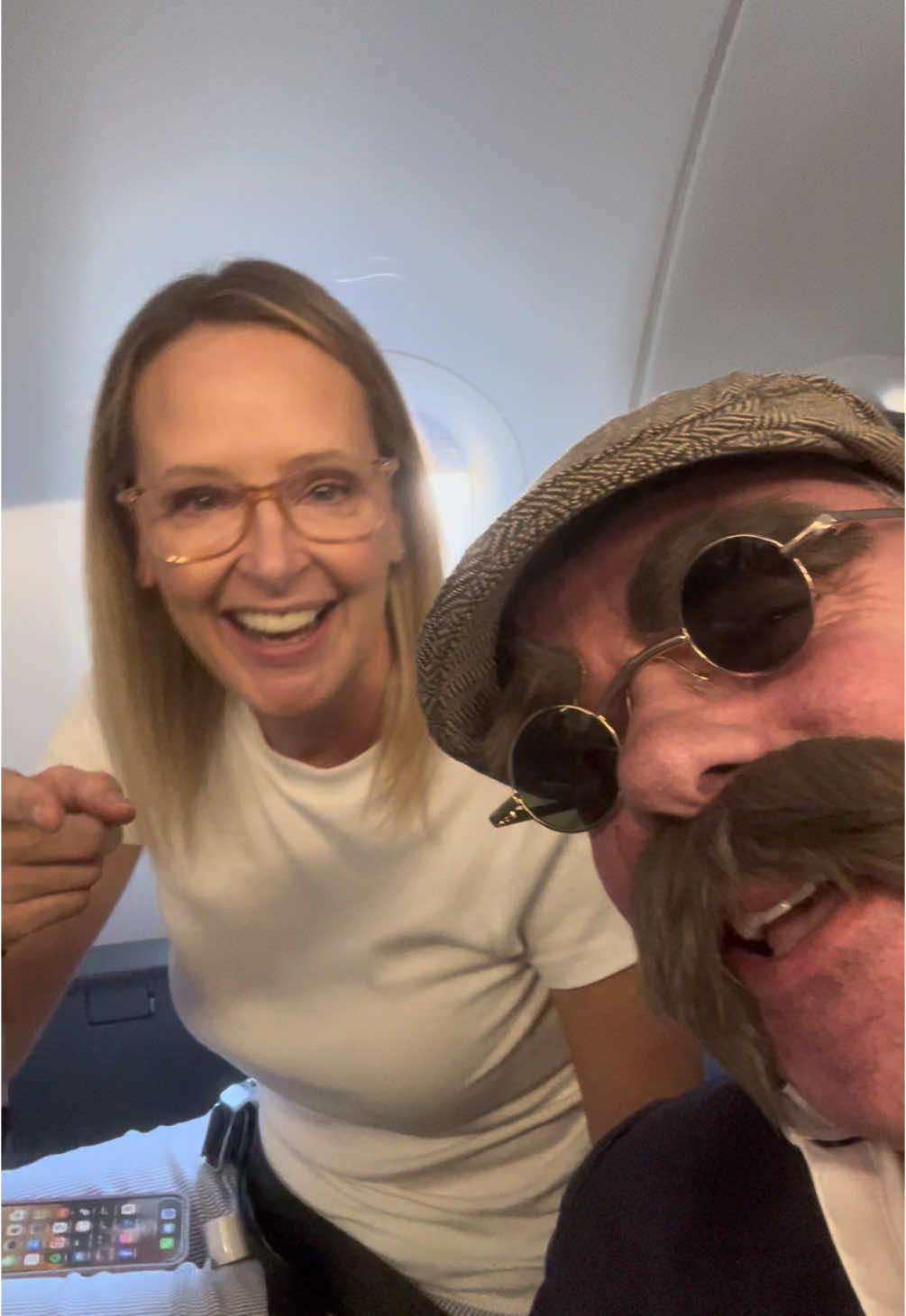 In all my 50 years, the best surprise was when my oldest brother disguised himself and sat right next to me on my flight across the US to see my mom and twin brother for my birthday. #surprise #bestbrother #50thbirthday #unitedairlines #fyp #foryoupage #family #california #northcarolina 