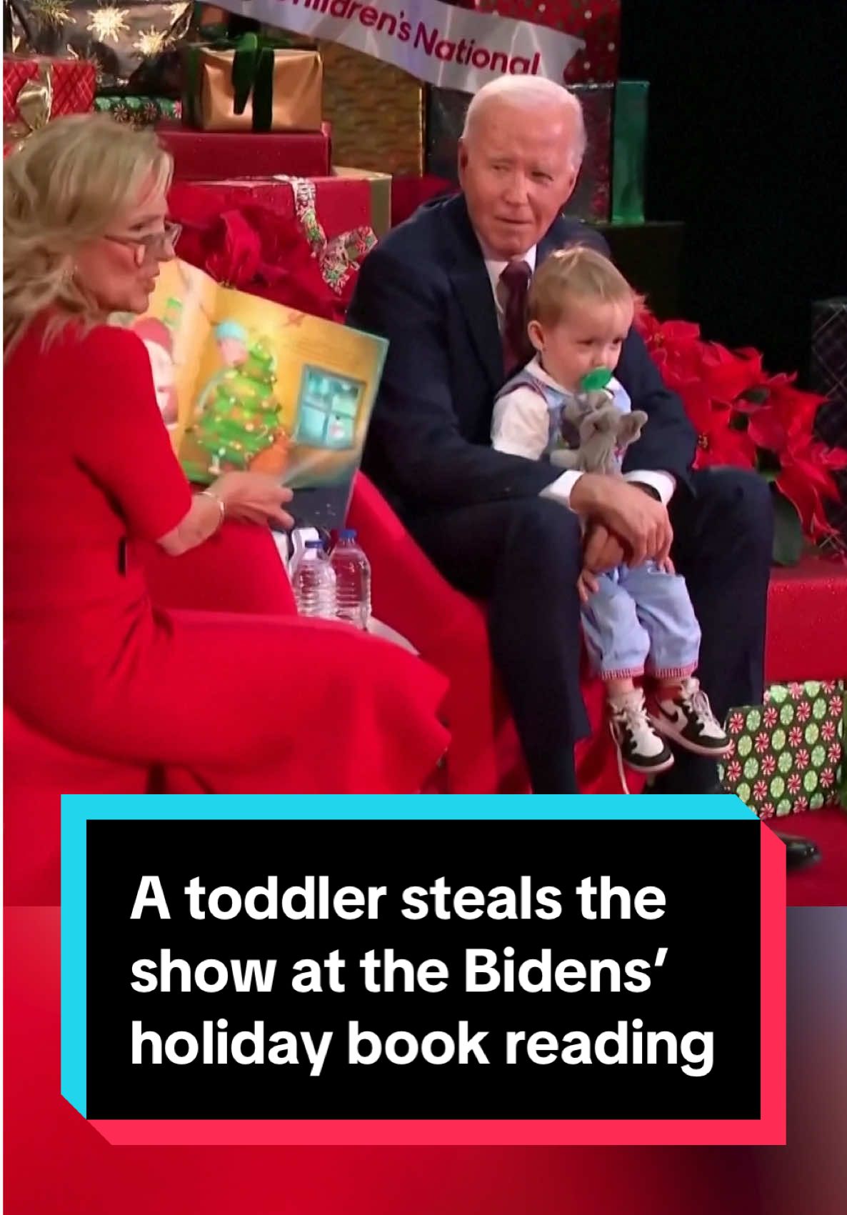 A toddler in a light blue jumper stole the show at the Bidens’ annual holiday book reading at Children’s National Hospital. The president and first lady spent time privately with patients and their families for photos before Jill Biden read “‘Twas the Night Before Christmas” to a group of young patients. #joebiden #jillbiden #childrenshospital #whitehouse #holiday #christmas #politics #news 